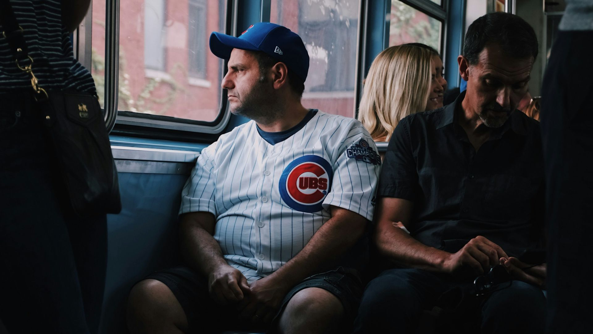 people sitting and standing inside the vehicle