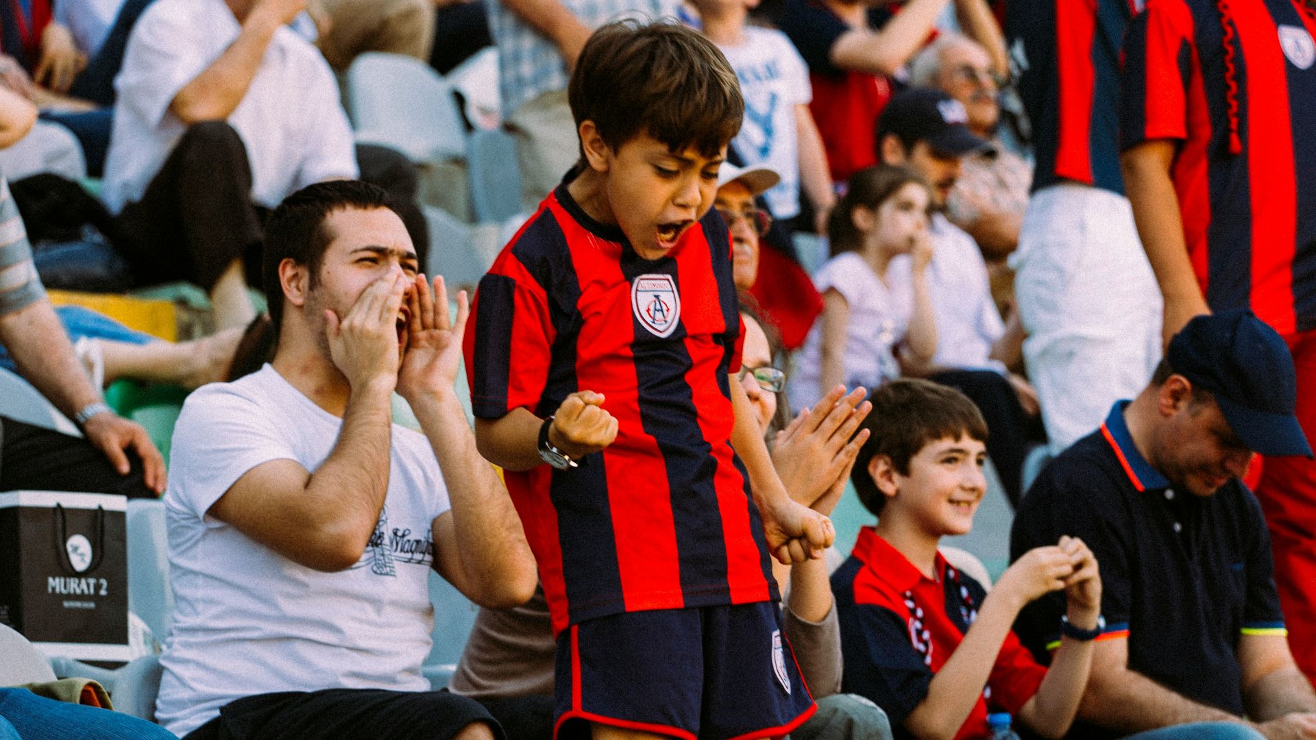 woman in red and black dress sitting on white chair
