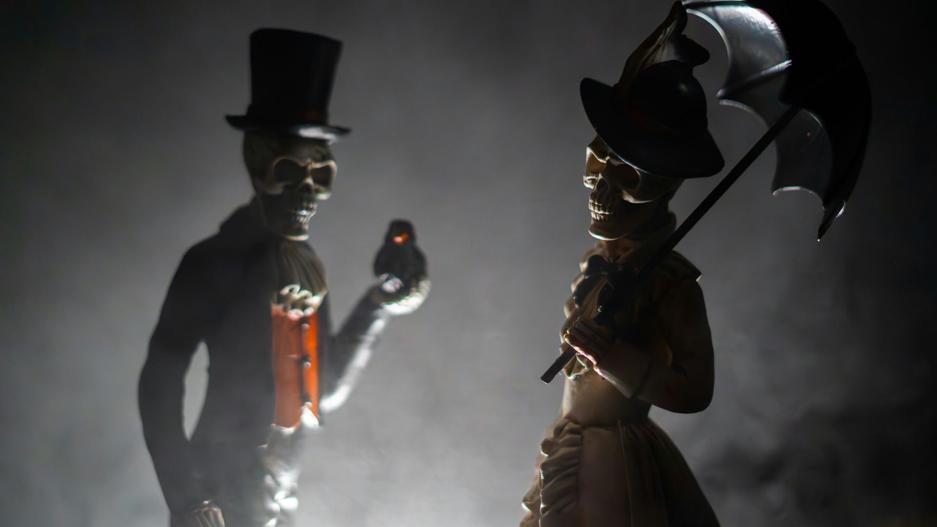 A couple of people that are standing in the dark