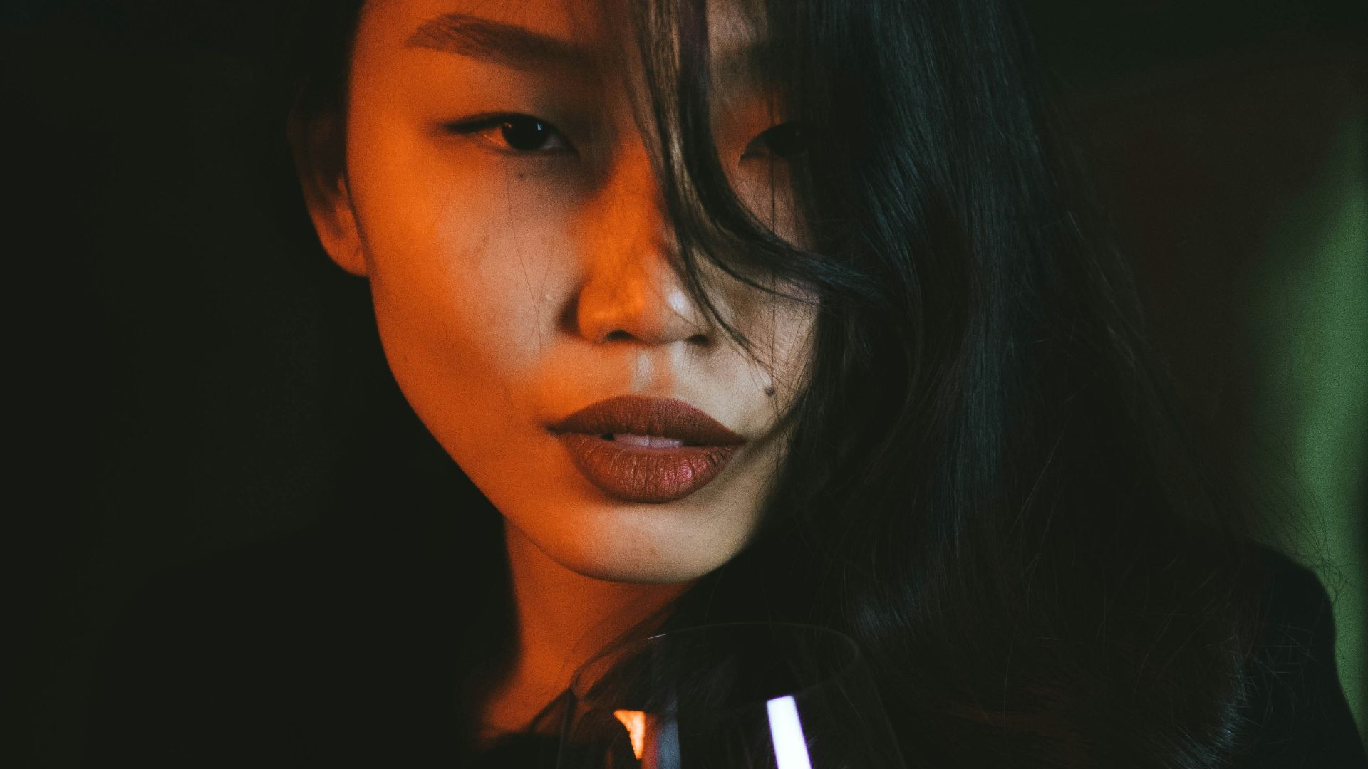 woman holding black and white ceramic mug