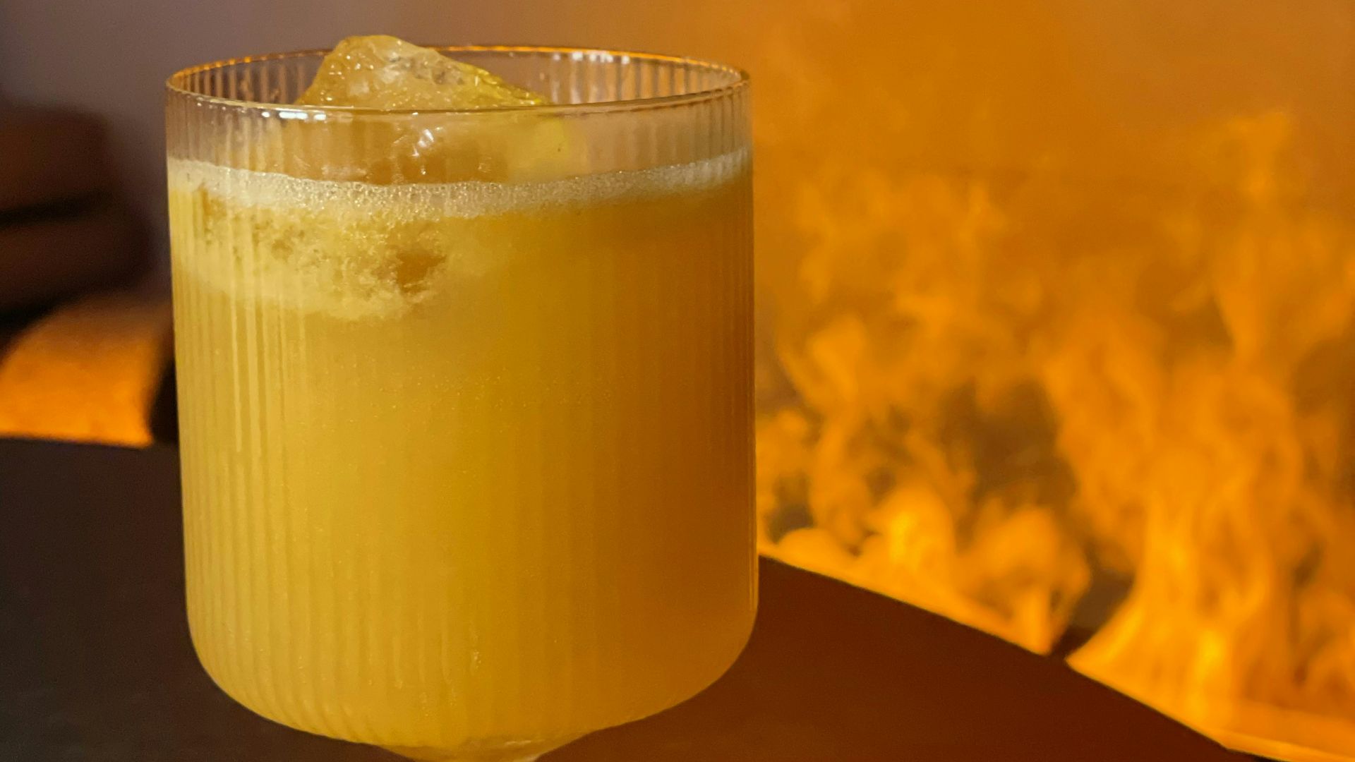 a glass of yellow liquid