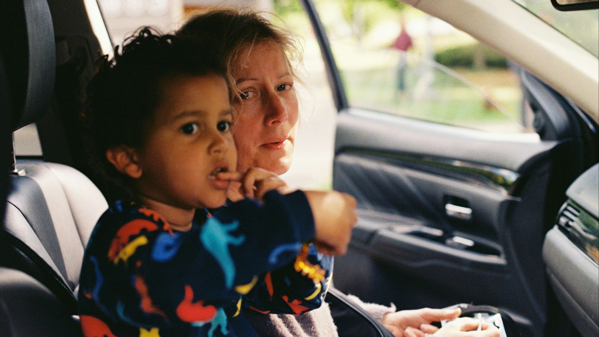 a person and a child in a car