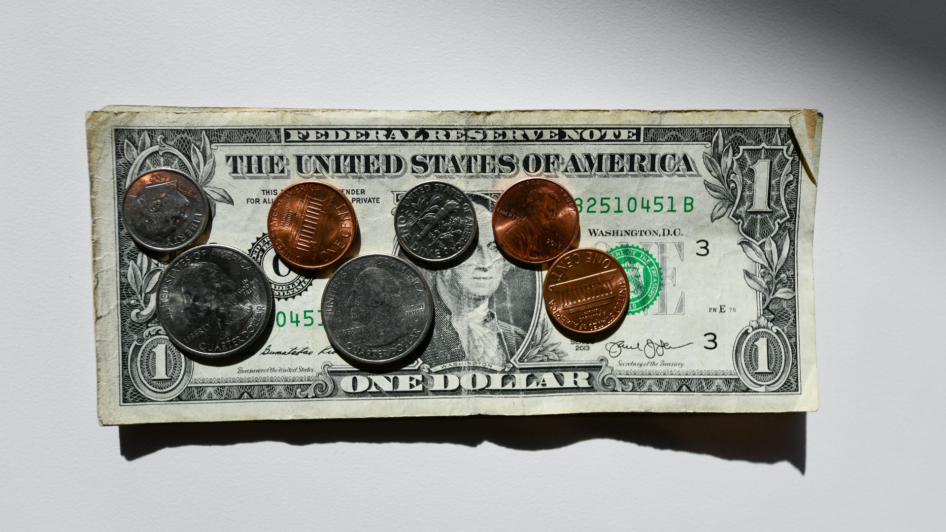 silver and gold round coins in box