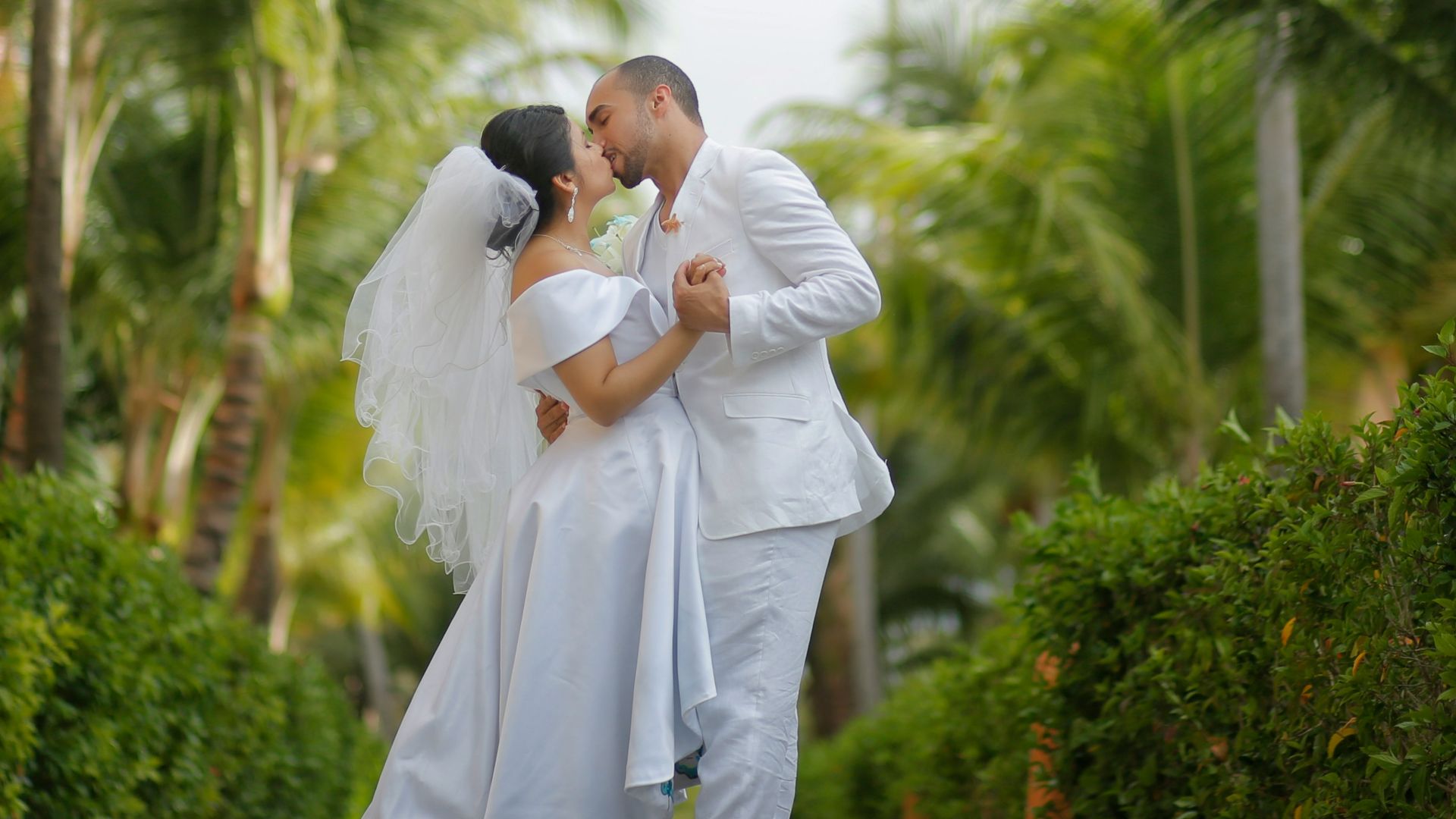 bridge and groom kissing