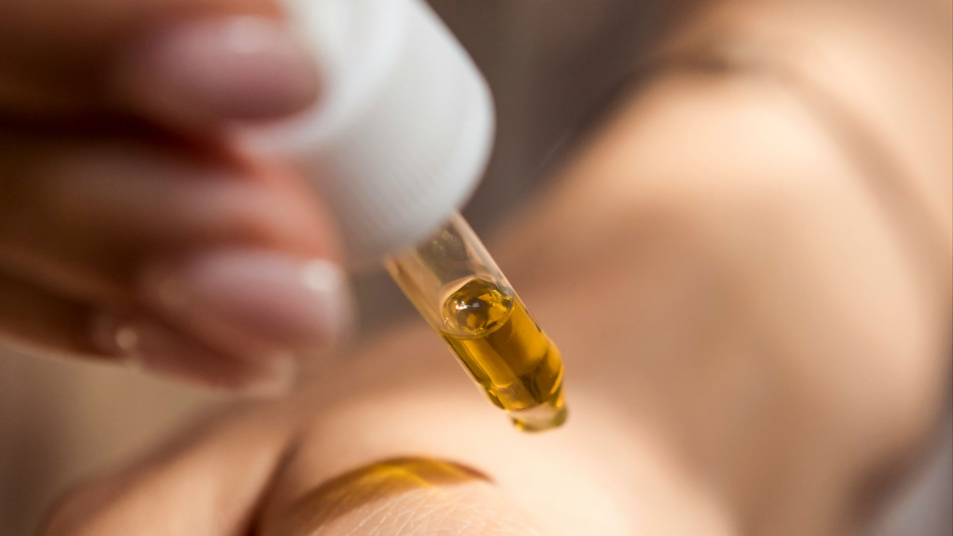 person holding dropper