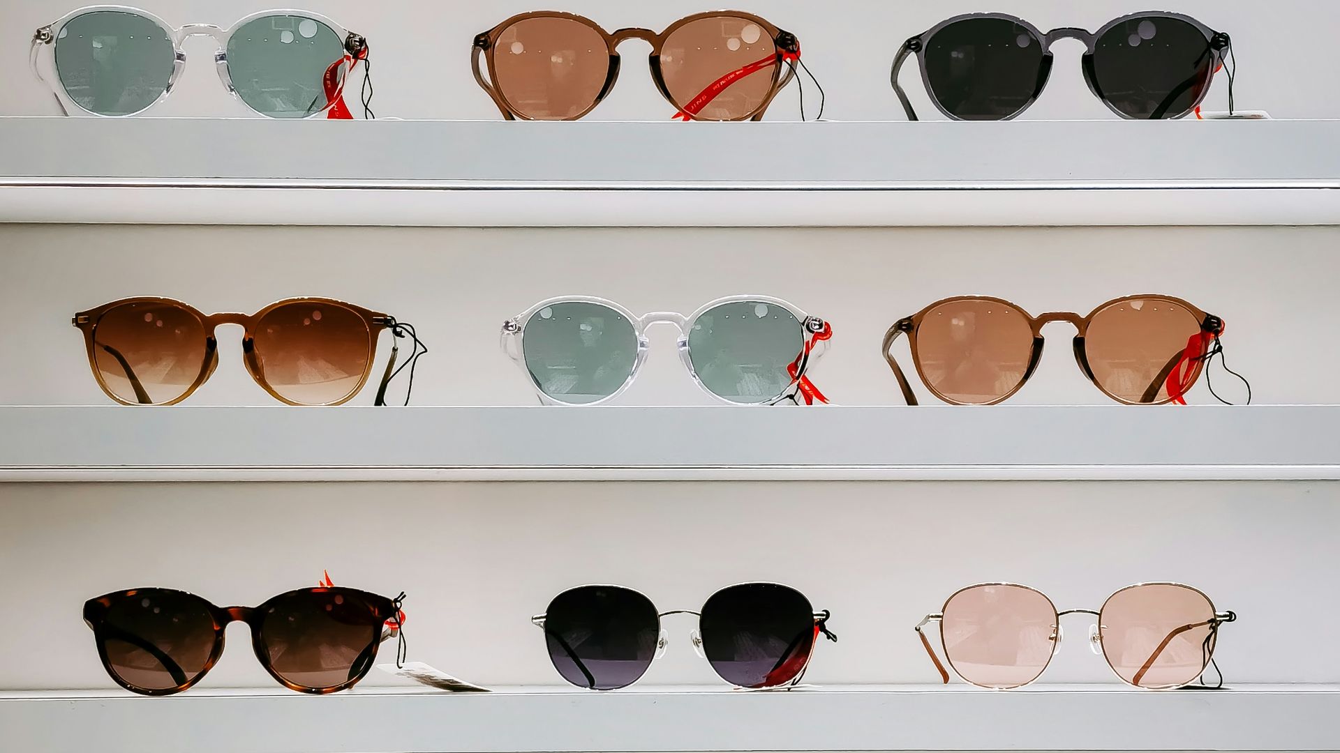 black framed sunglasses on white surface
