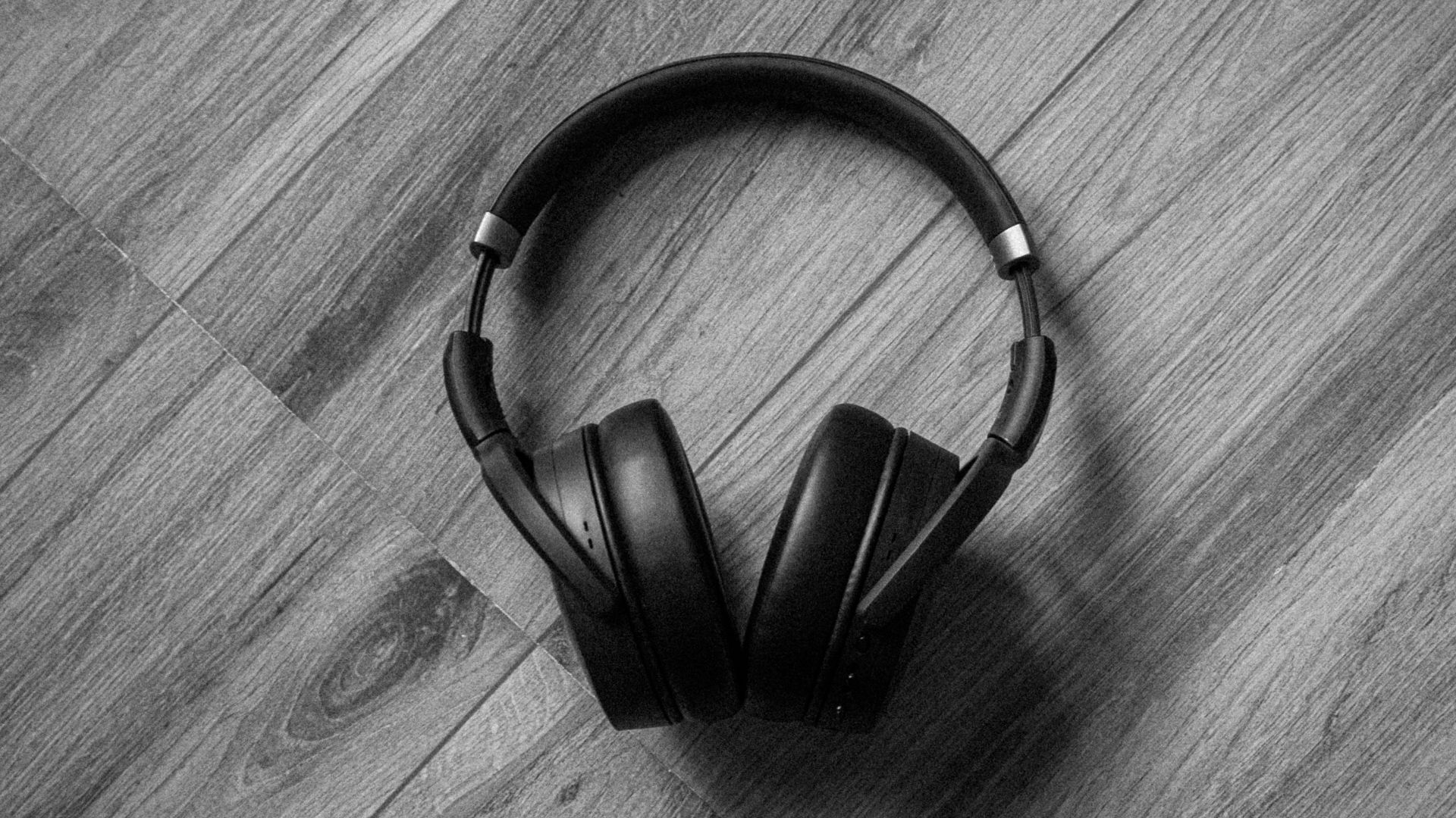 a black and white photo of a black and white purse on a wooden surface