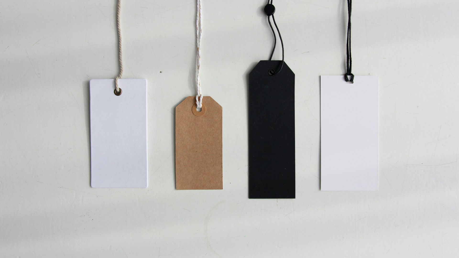 four paper card tags