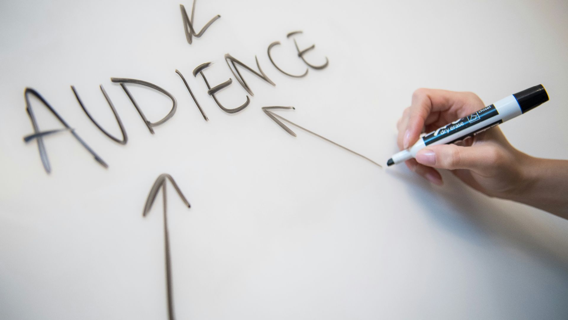 person writing on white paper