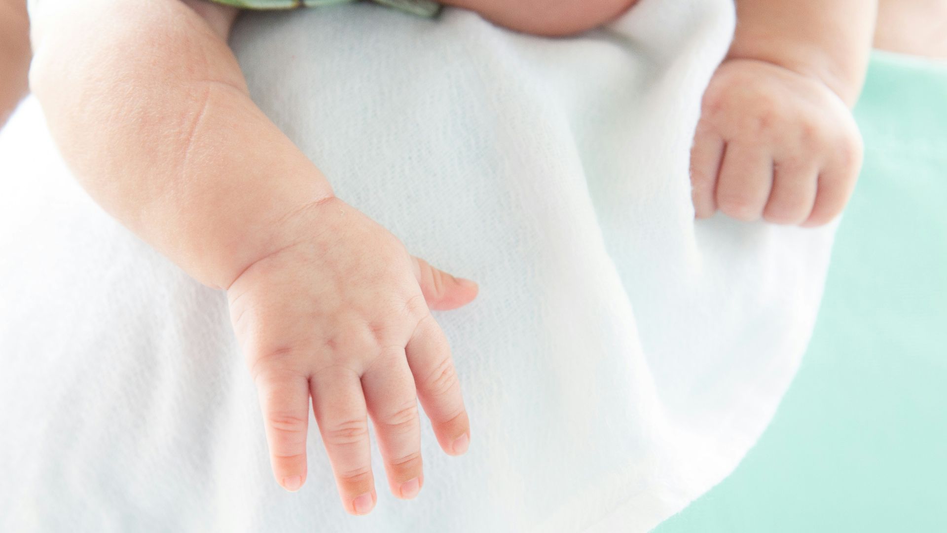 a close-up of a person holding the belly