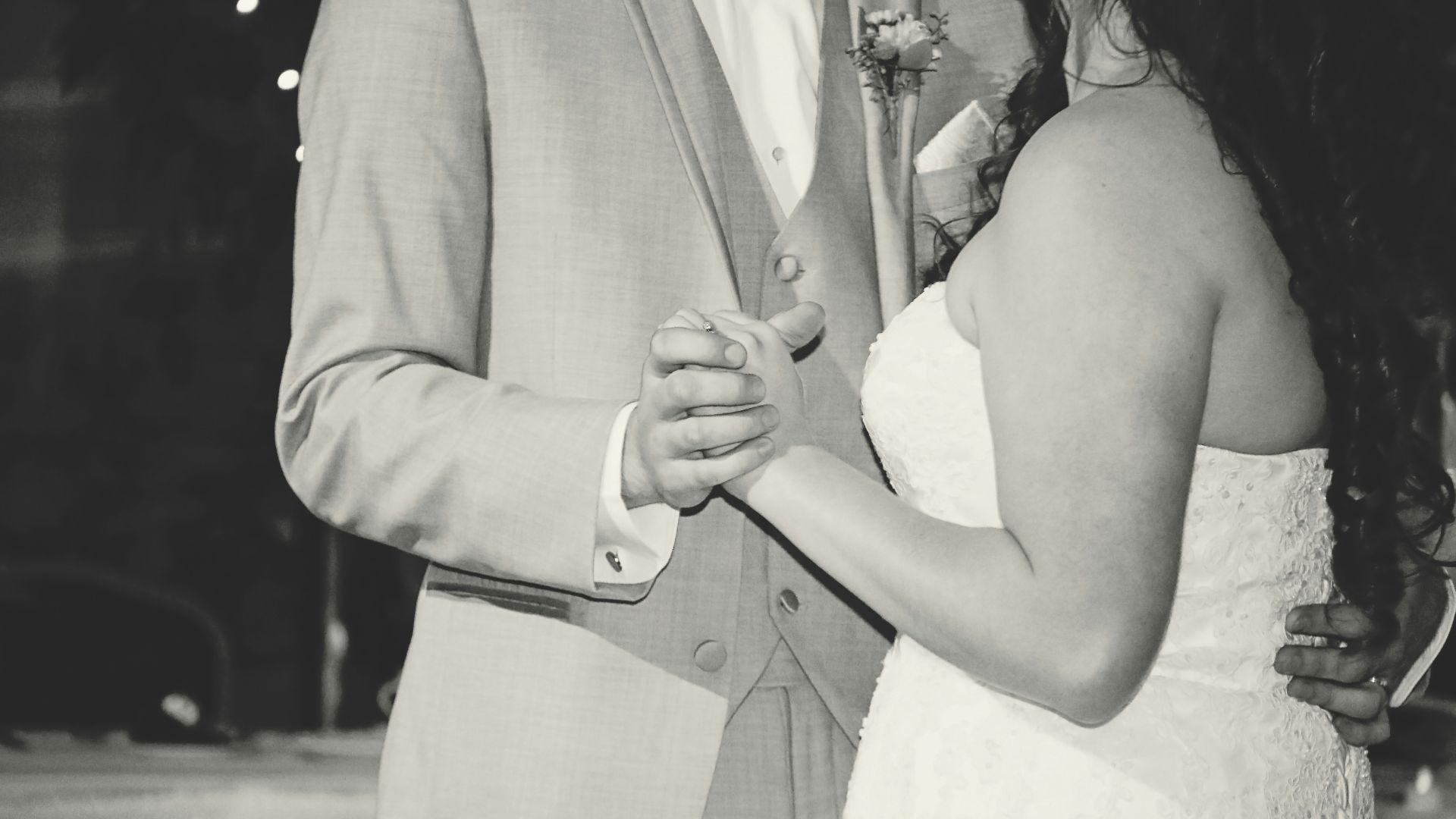 a man and a woman dance together at a wedding