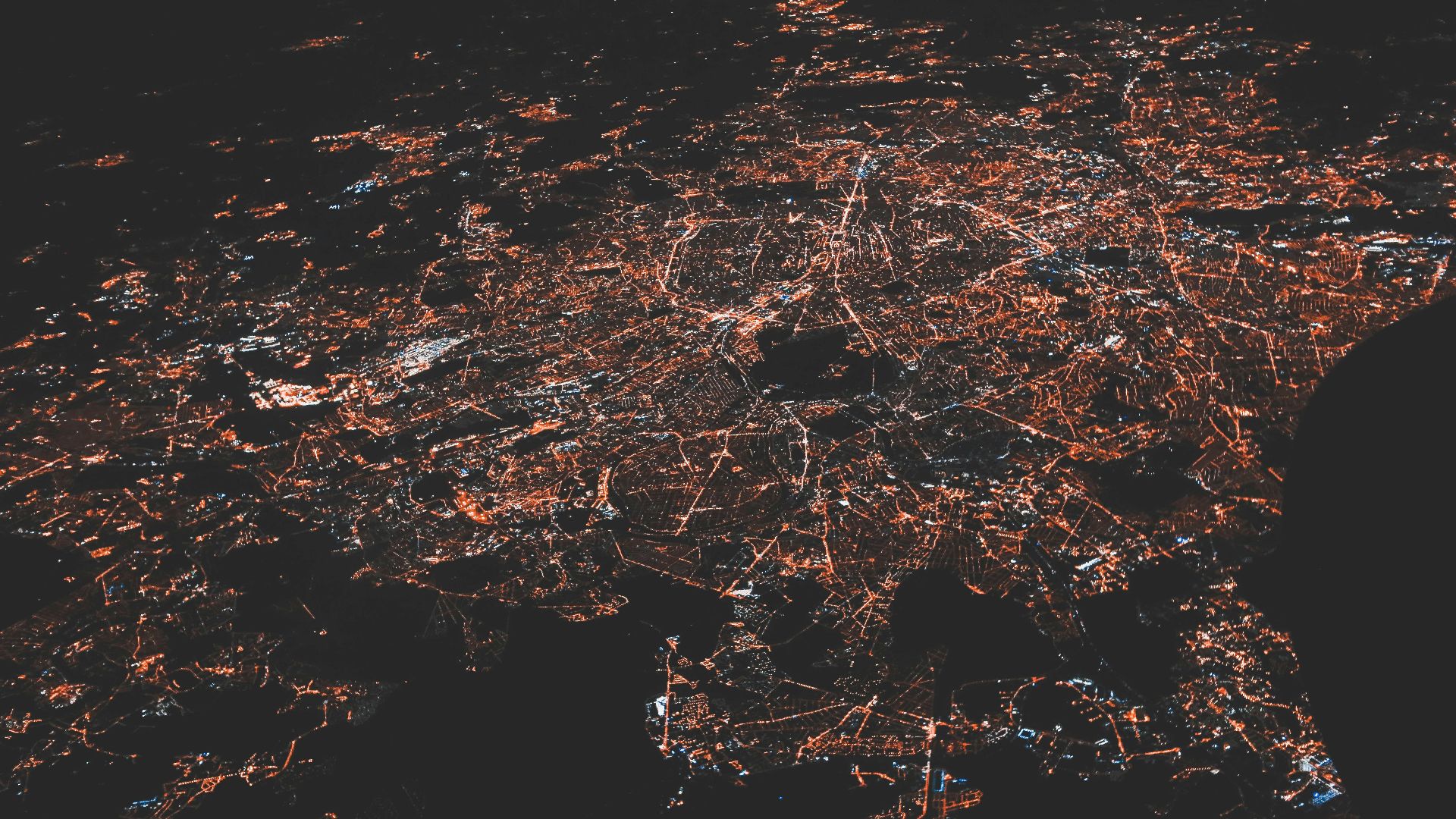 lighted city at night aerial photo