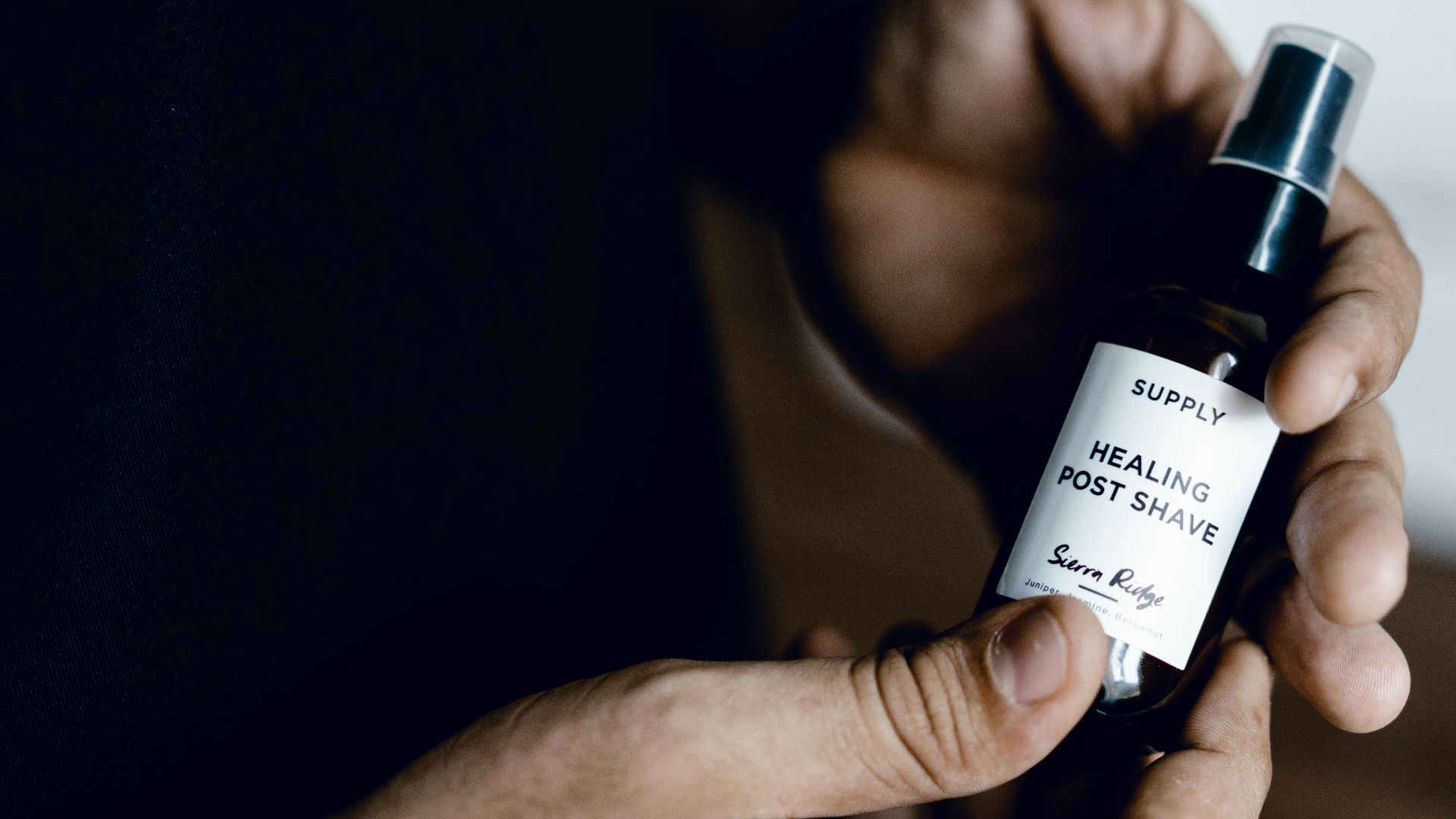 black and white labeled spray bottle