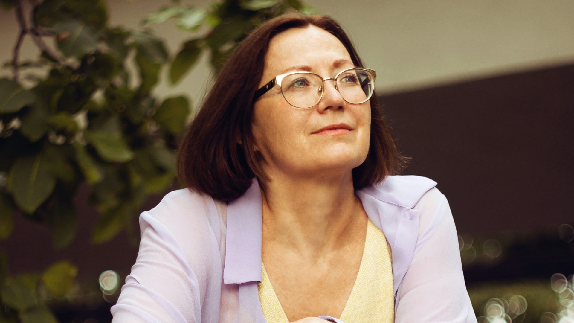 woman in white blazer and yellow dress shirt
