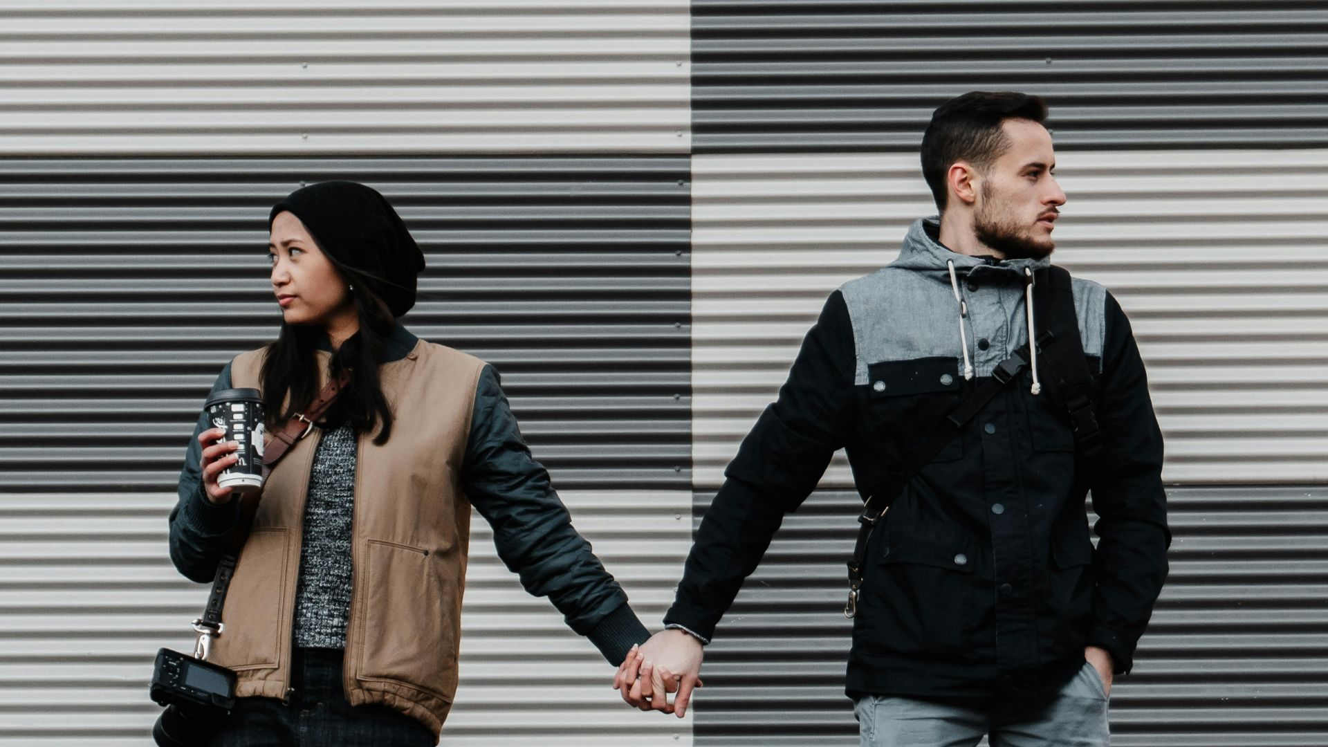 man and woman holding each other's hands