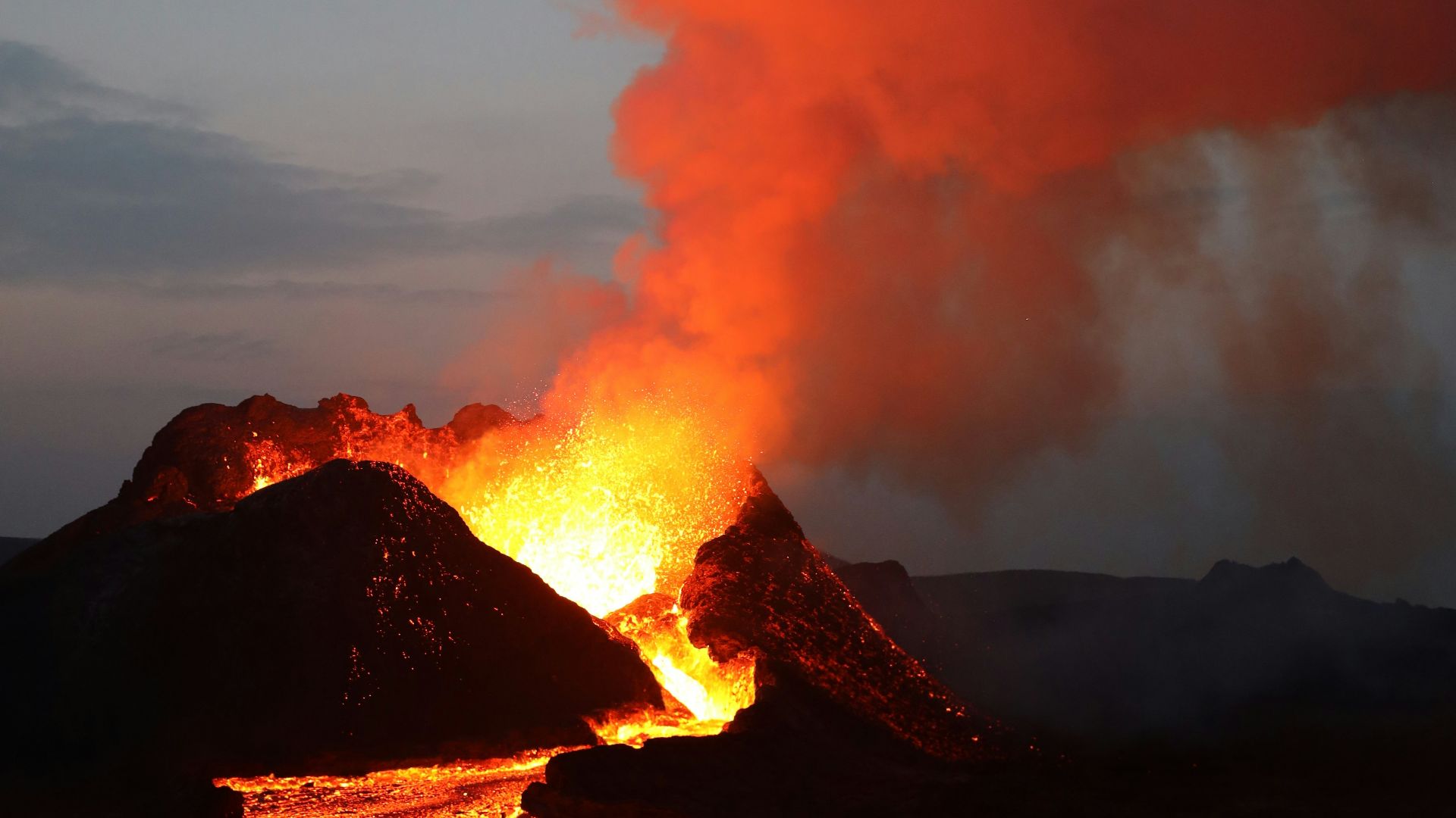 silhouette of mountain under cloudy sky during daytime