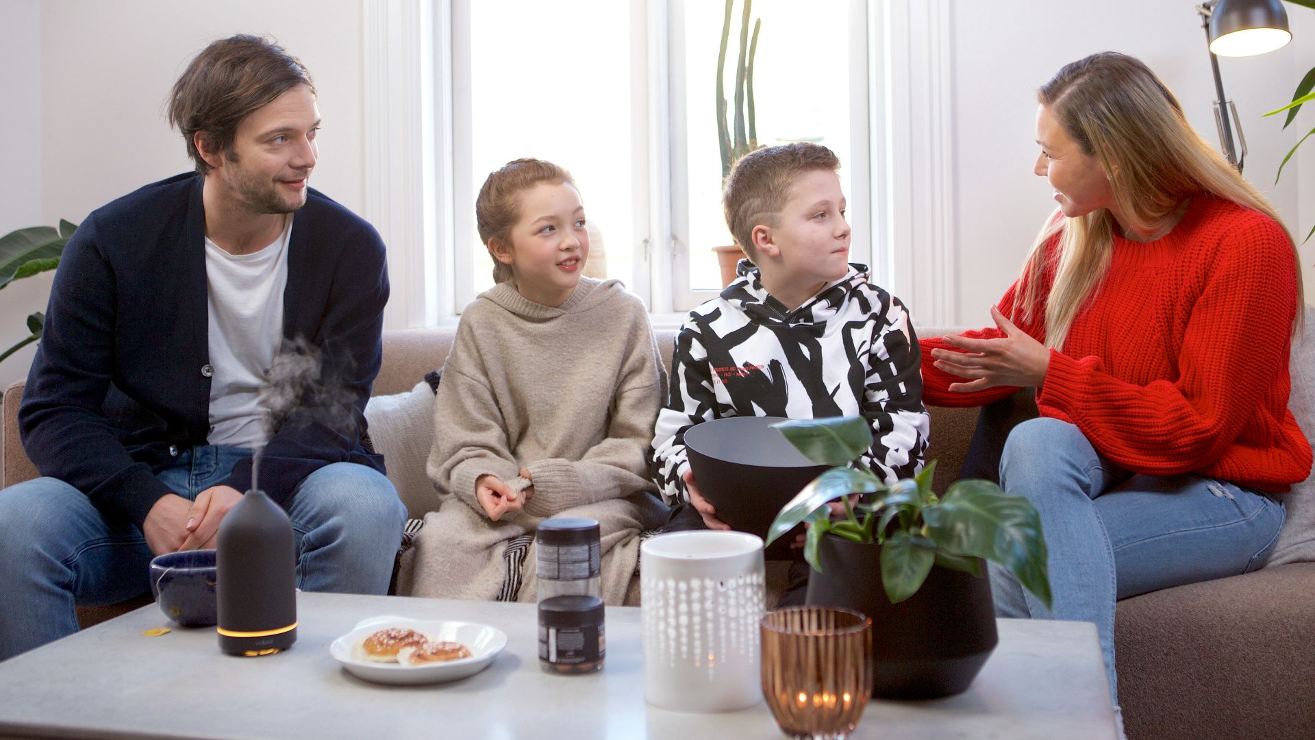a group of people sitting on top of a couch