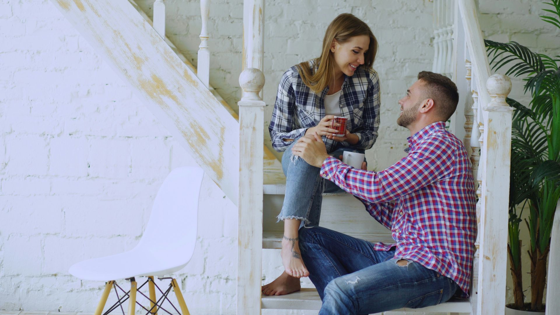 Couple talking on a staircase