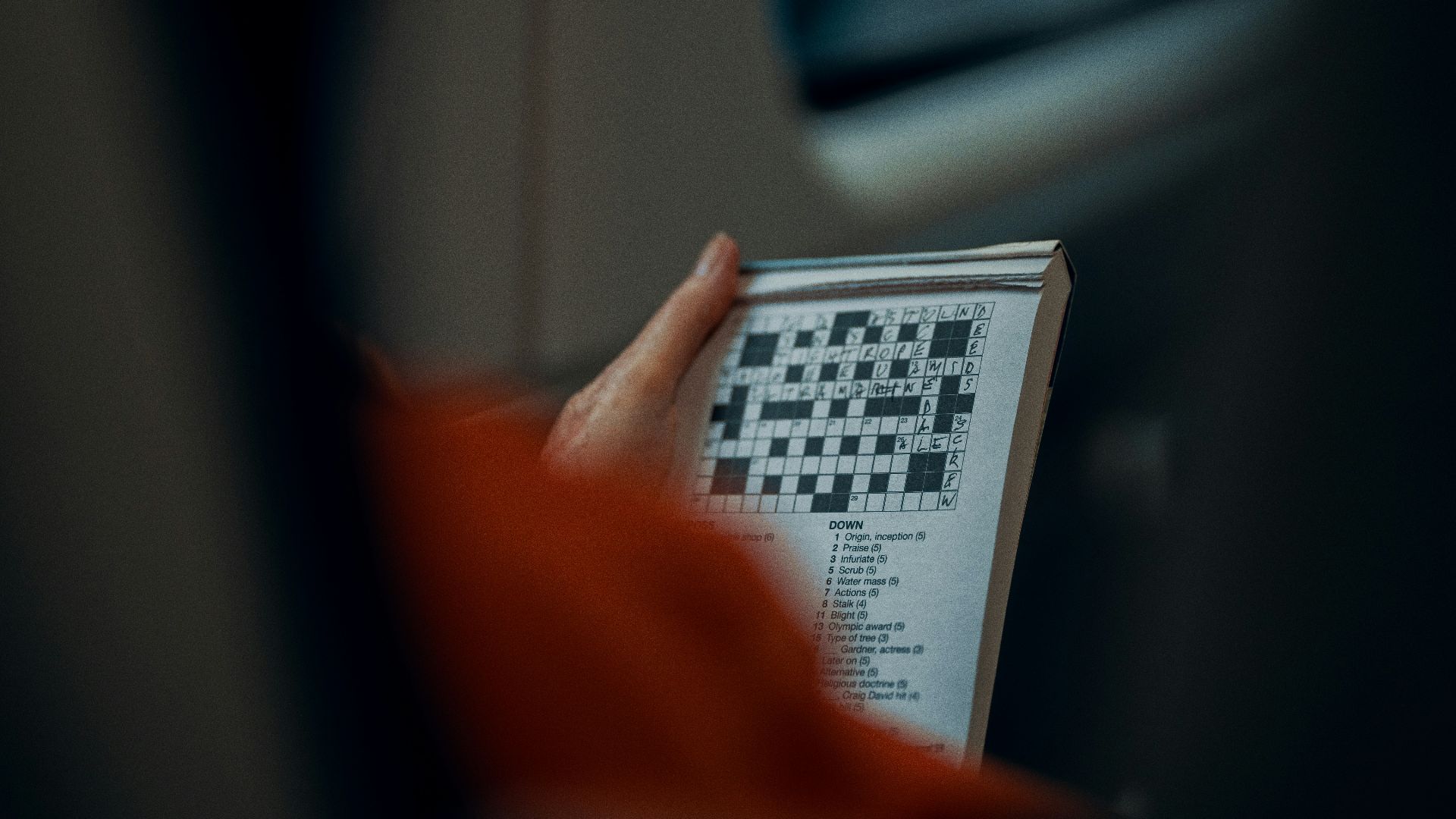person holding white and black paper