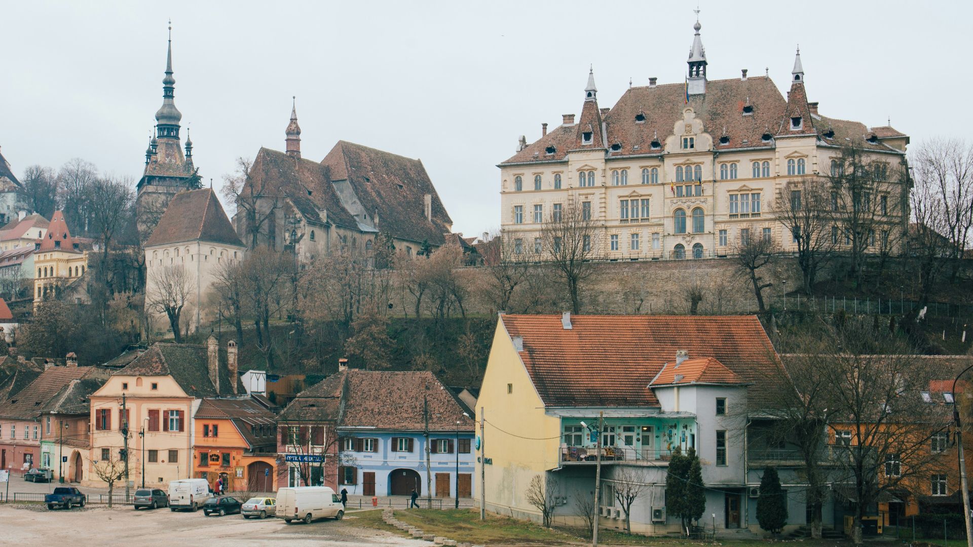 beige and brown gothic building on hill