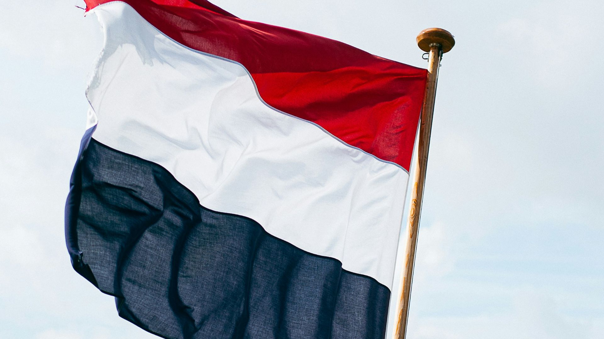 red and black flag on pole