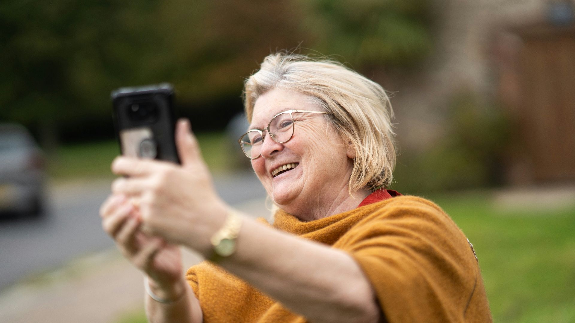 a woman taking a picture with her cell phone