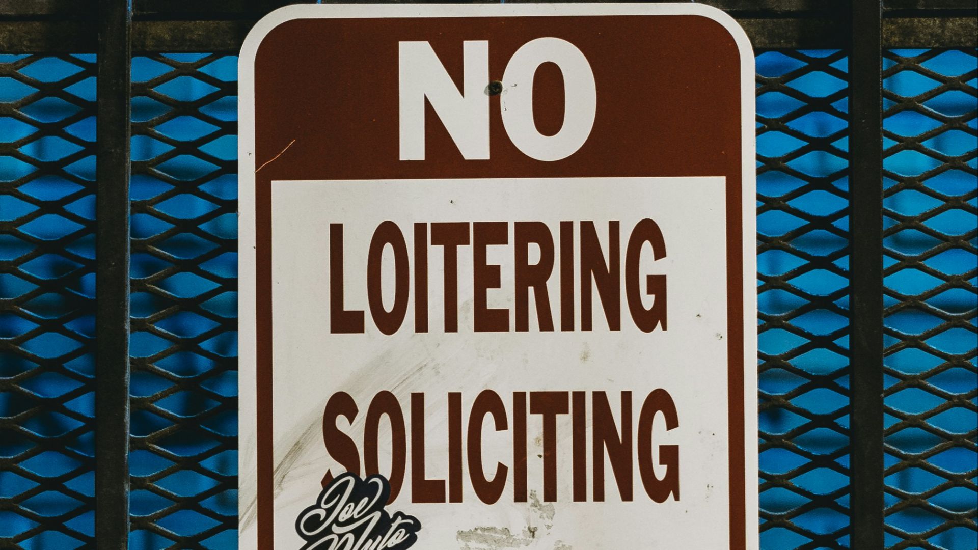 a stop sign on a fence