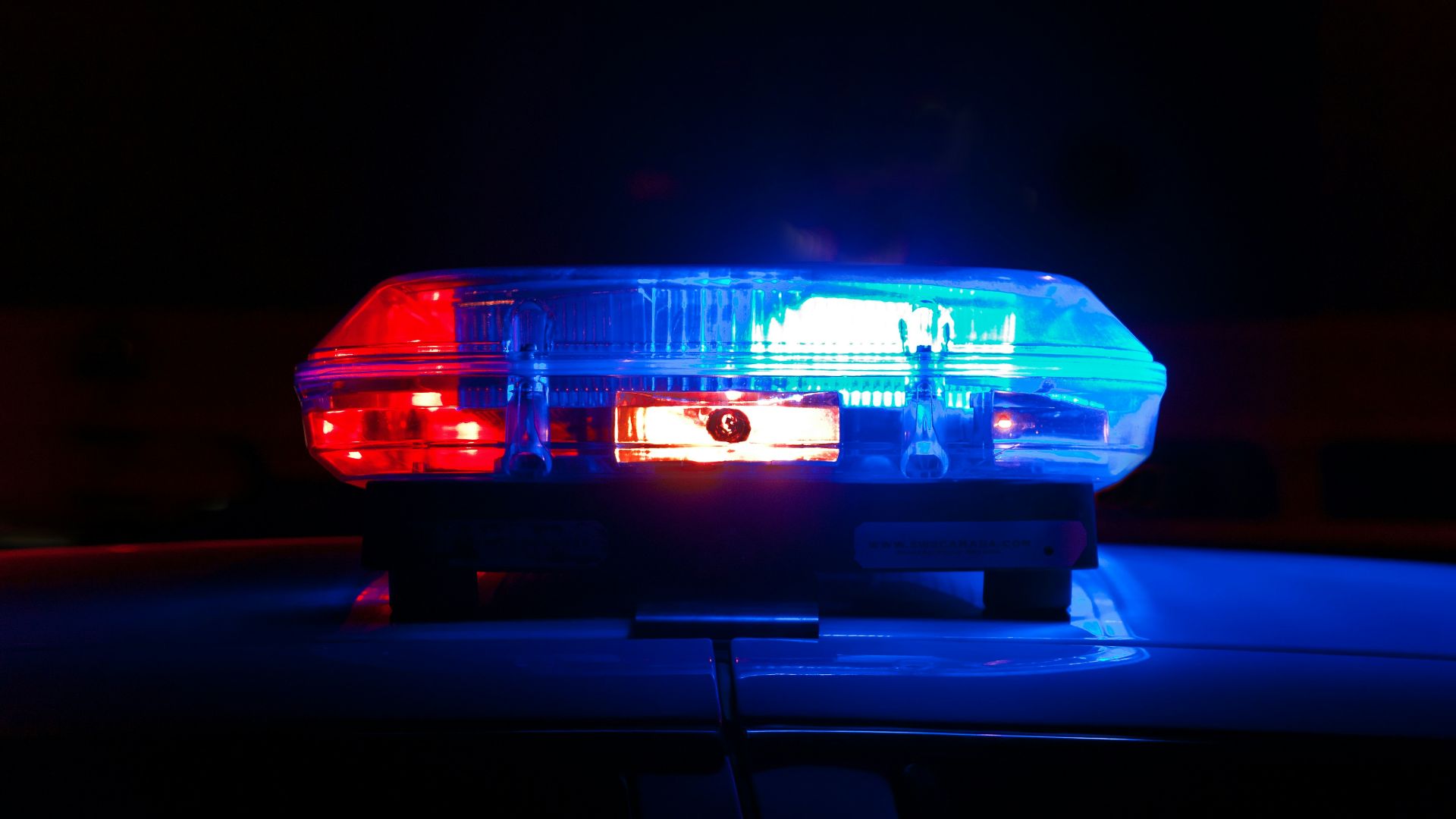 blue bmw car in a dark room