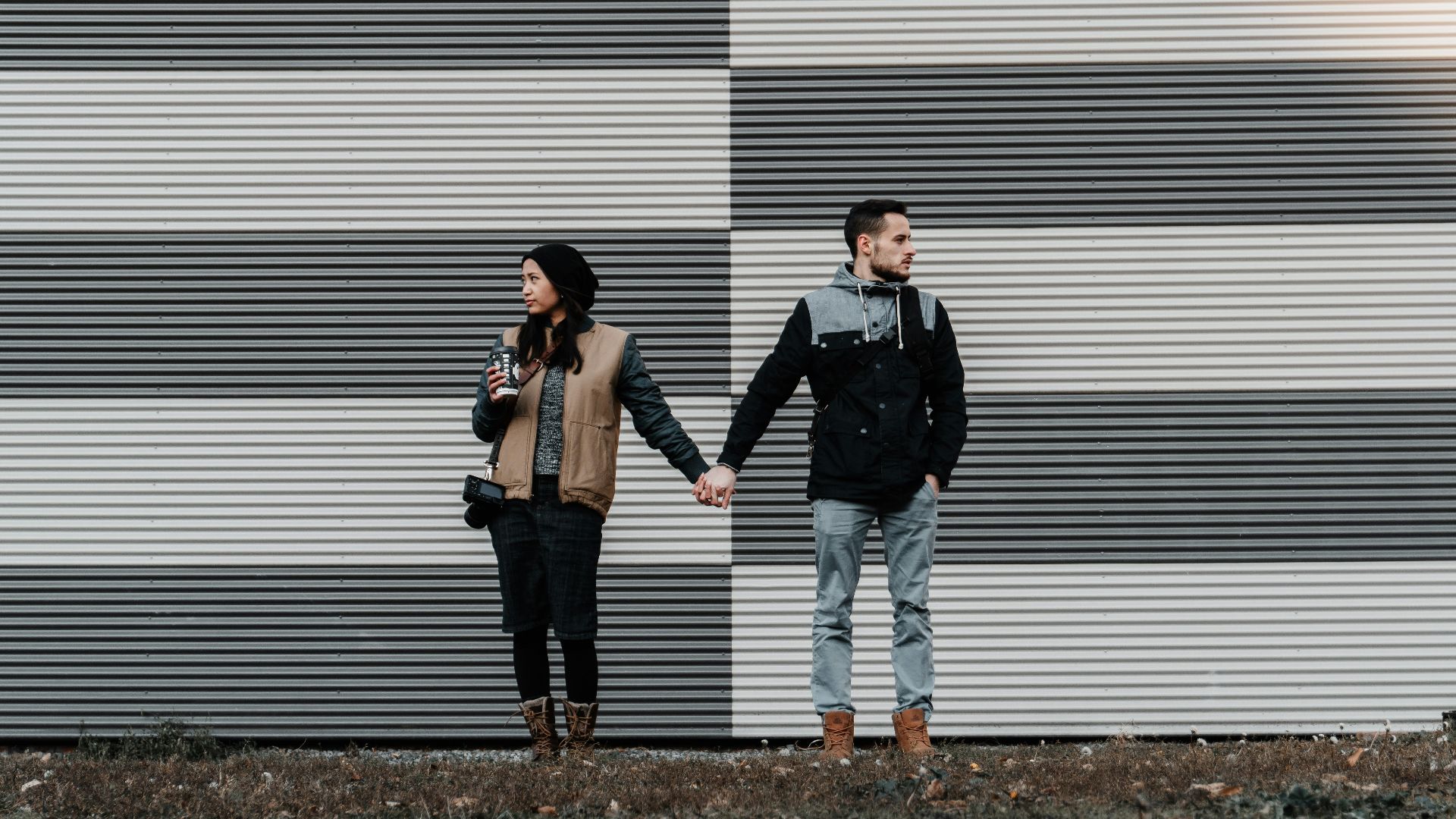 man and woman holding each other's hands