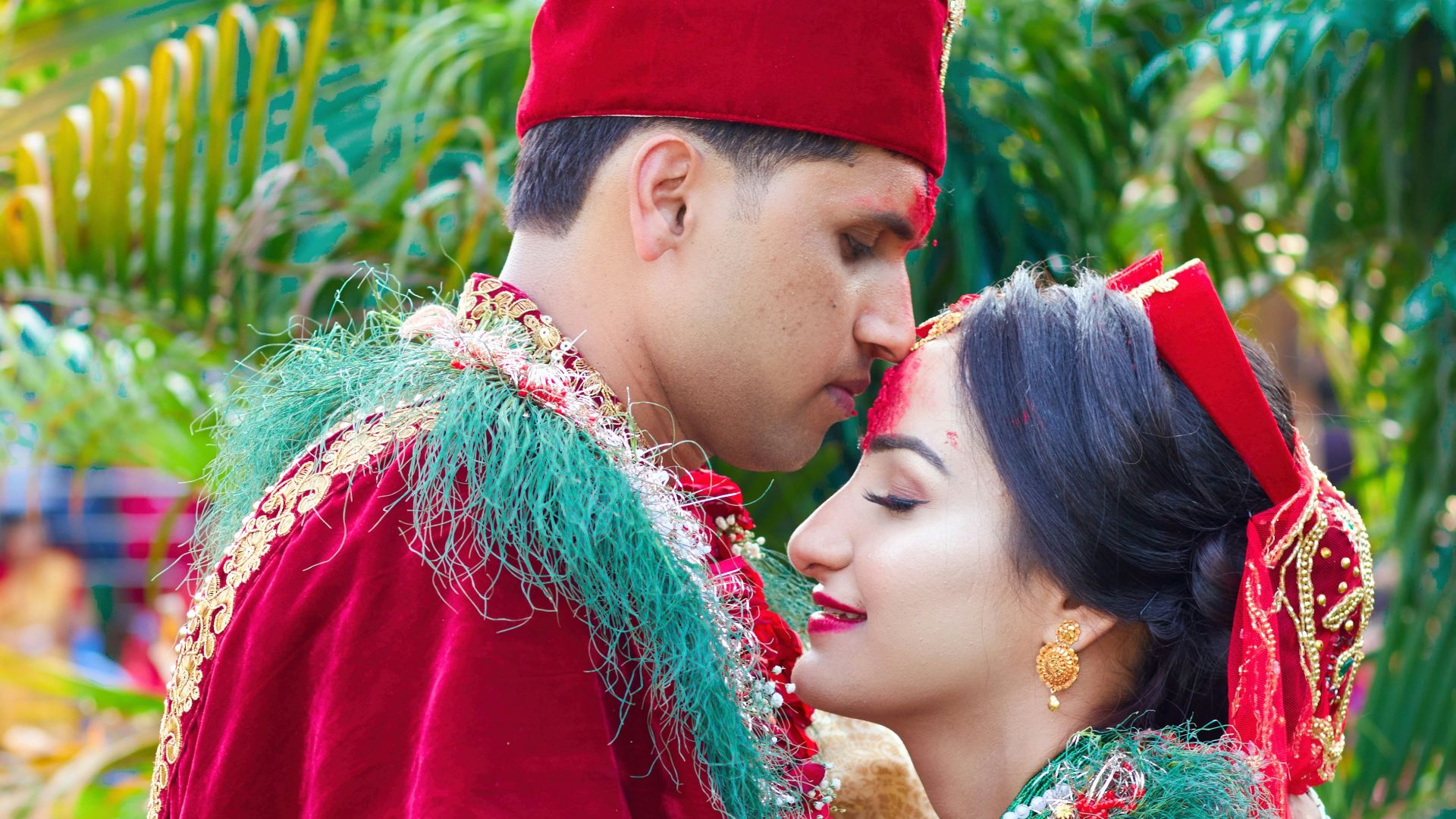 a man and woman dressed in traditional indian garb