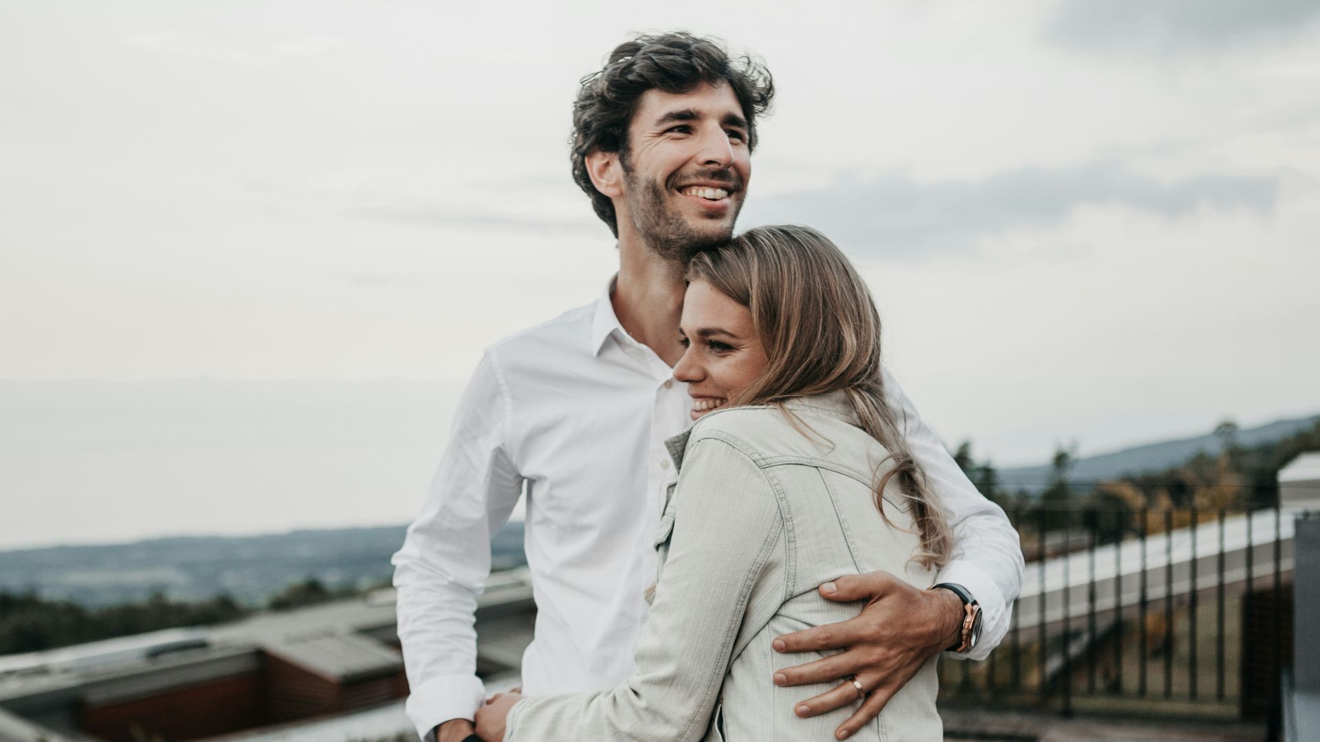 man and woman hugging each other