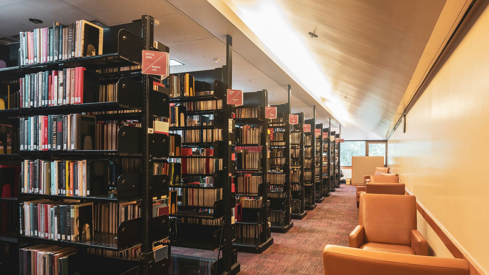 a row of bookshelves filled with lots of books