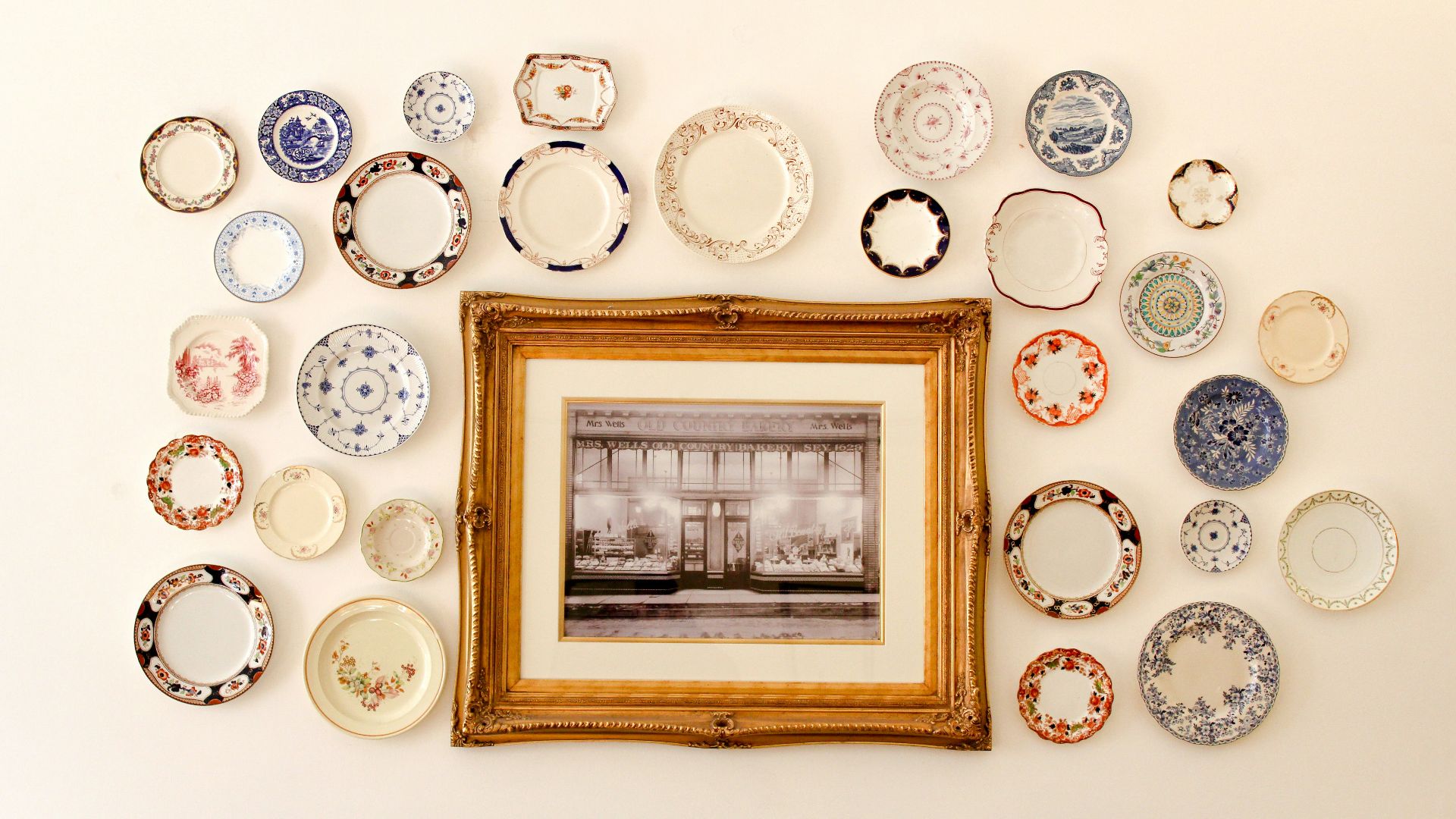 photo frame near assorted-color ceramic dishes
