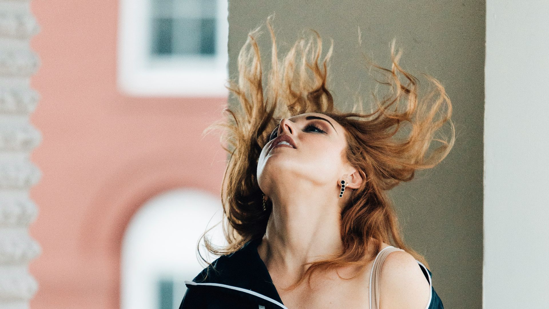 a woman leaning on a railing