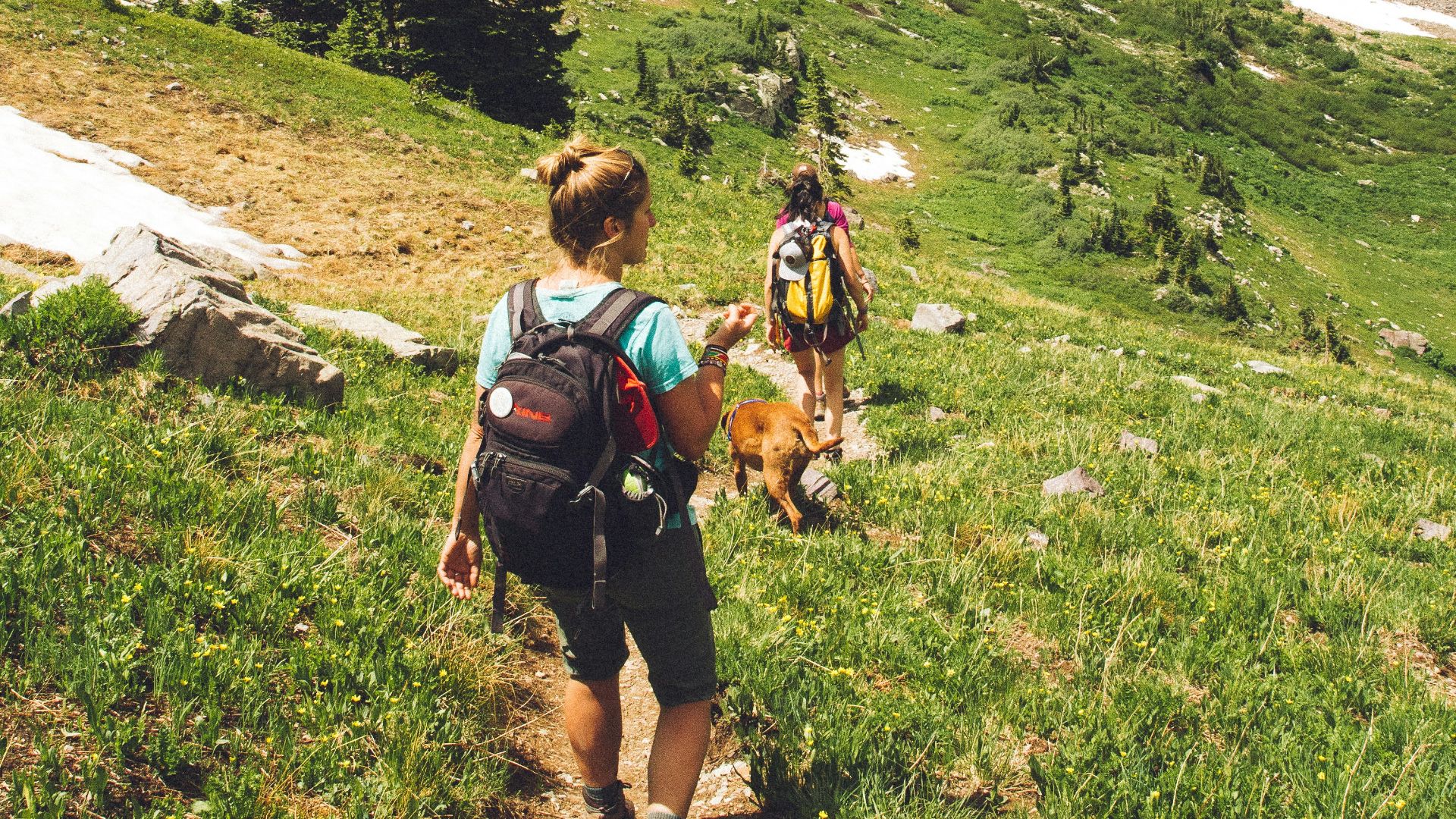 woman walking down the hill at daytime