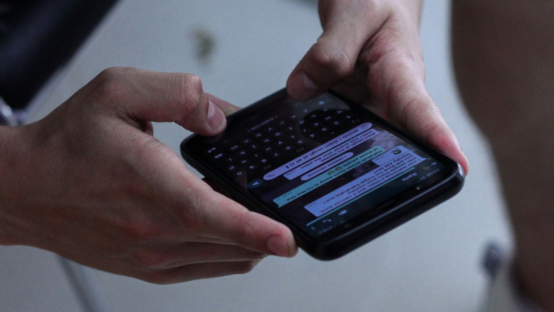 person holding black iphone 4