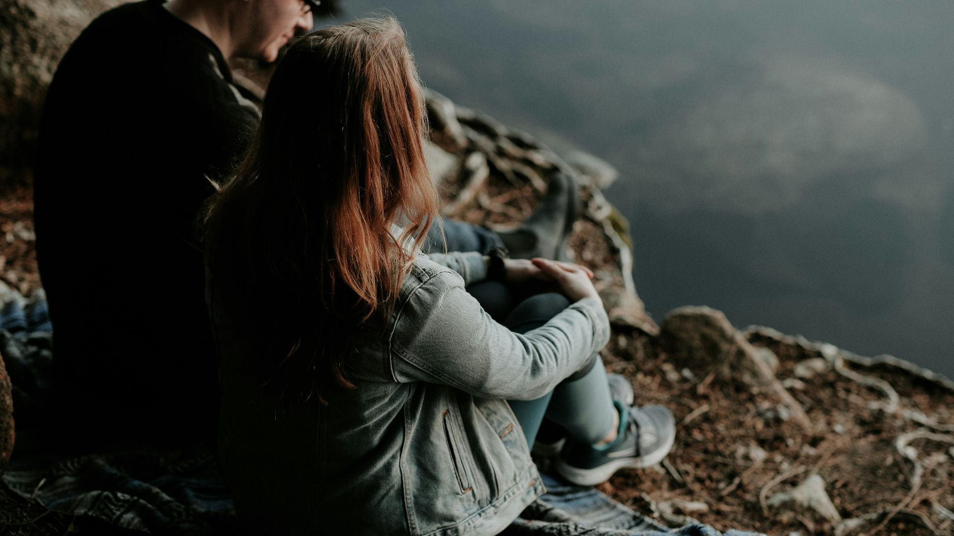 man and woman sitting outdoor