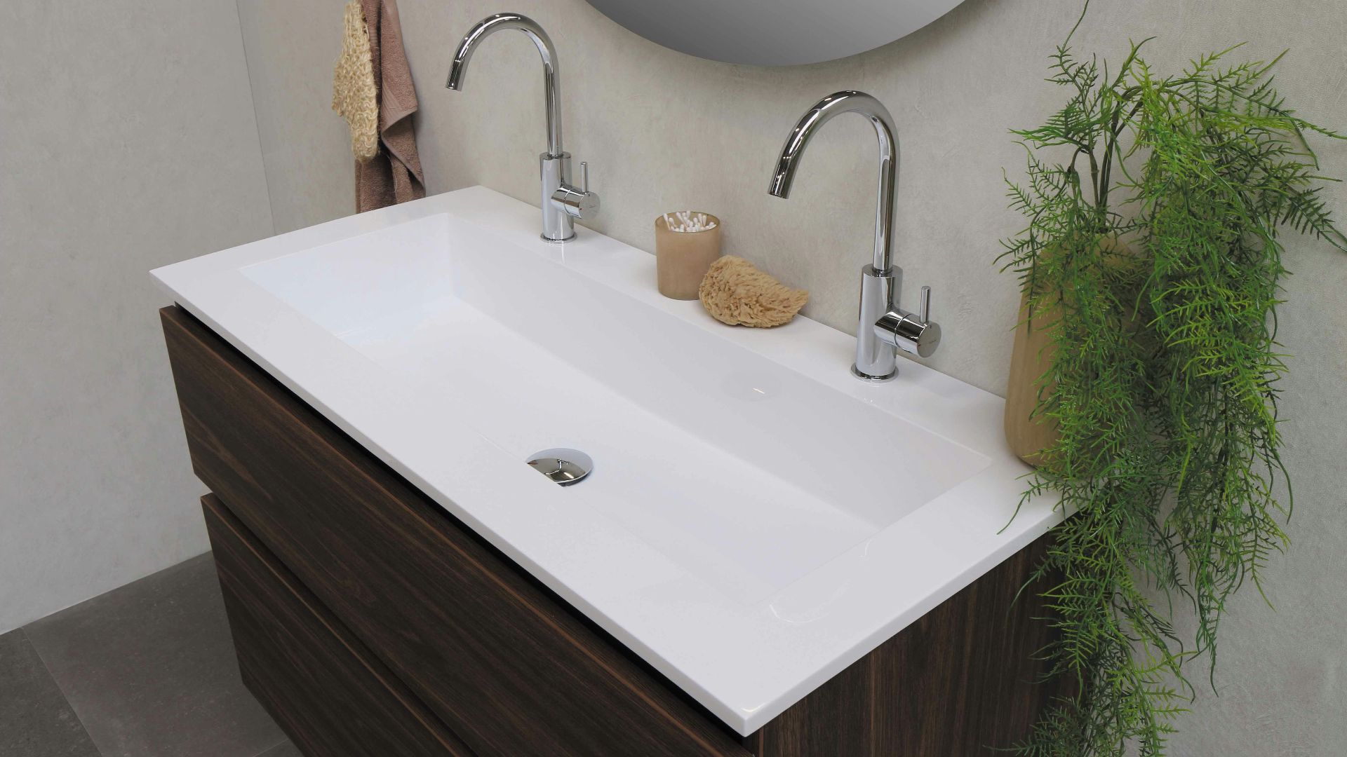stainless steel faucet on white ceramic sink