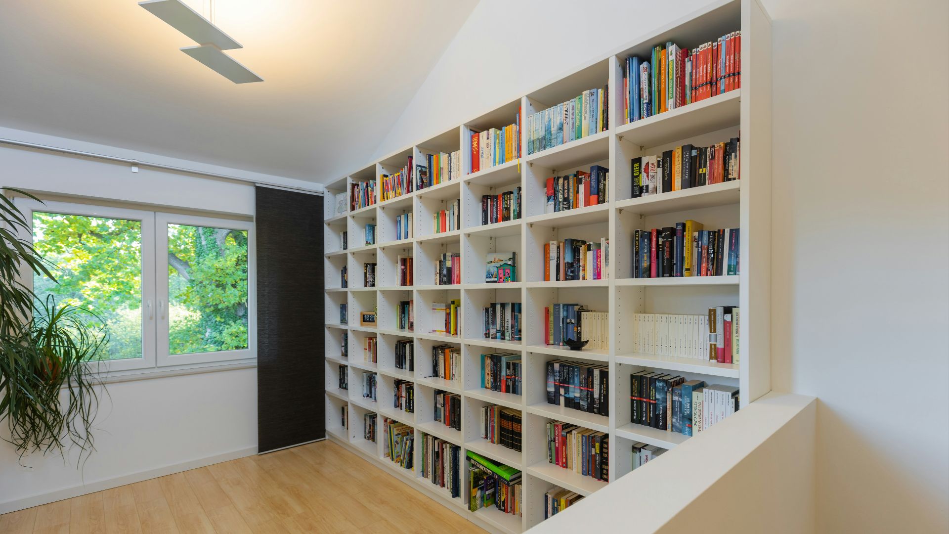 books on brown wooden shelf