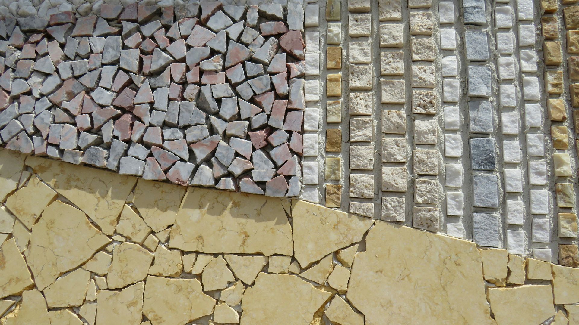 a close up of a wall made out of different types of tiles