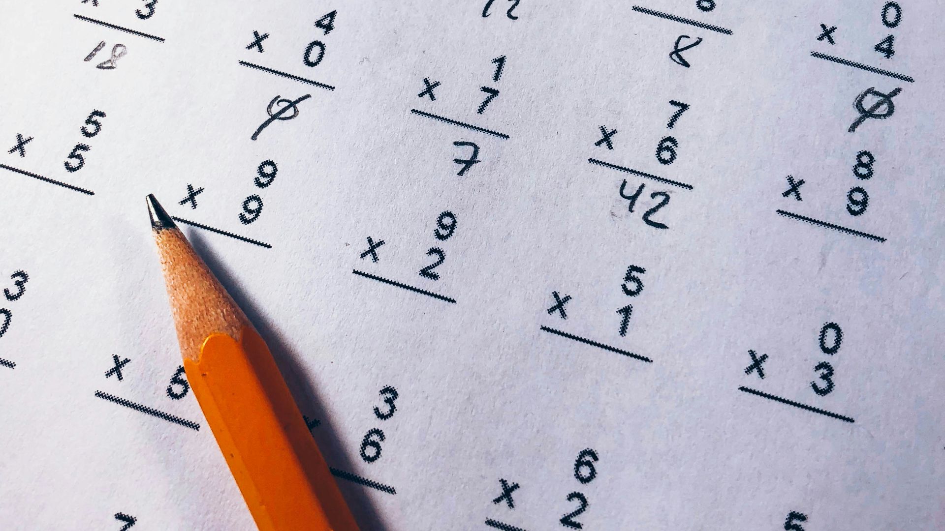 brown pencil on equation paper