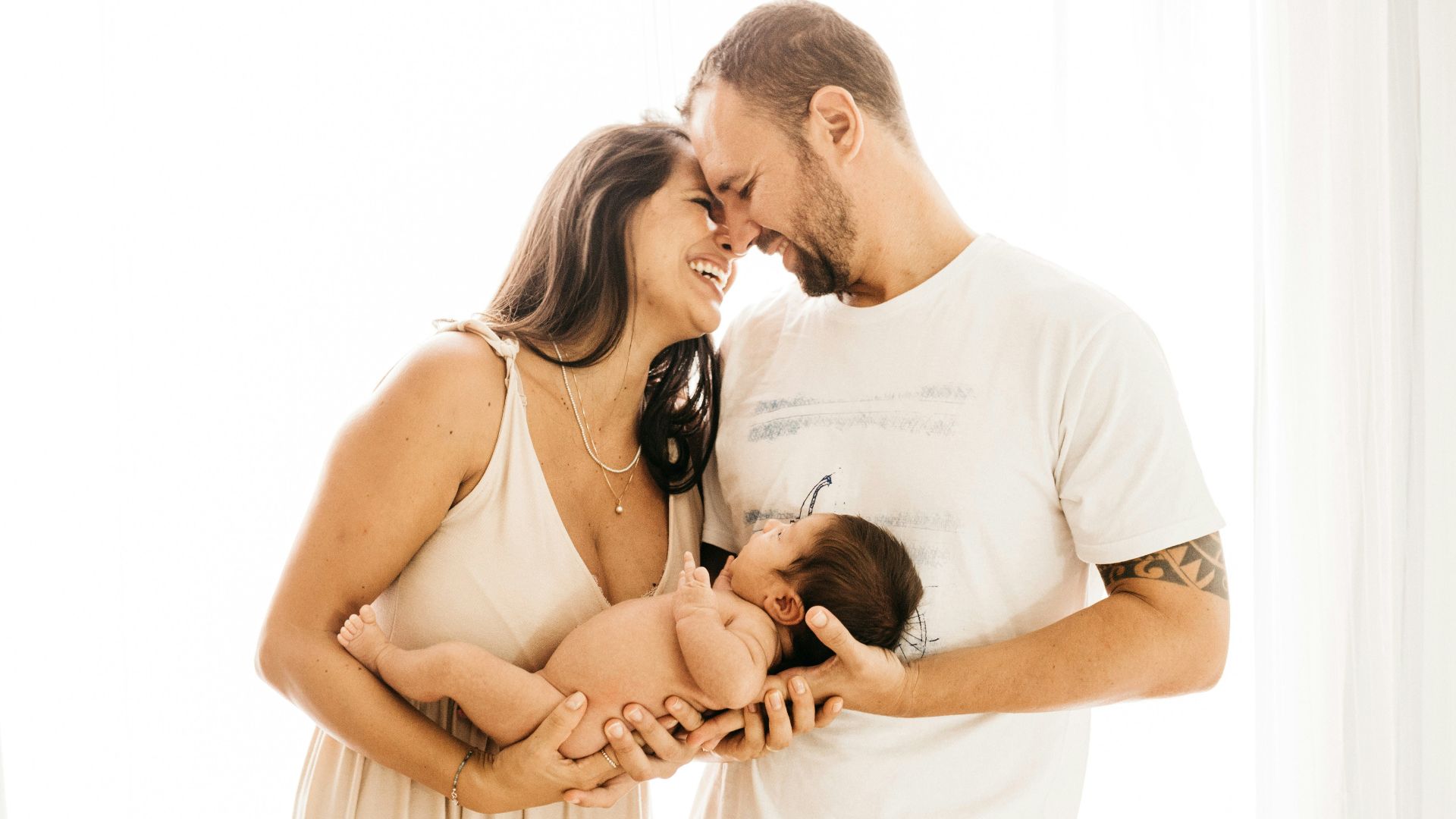 man in white crew neck t-shirt kissing woman in white dress