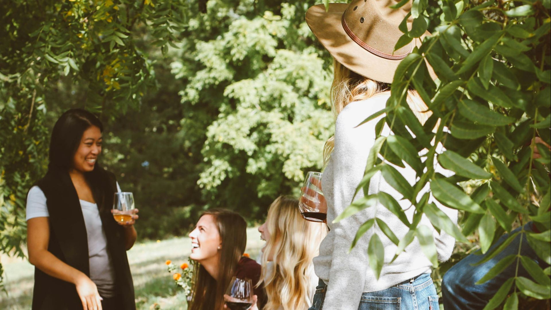 group of women in forest drinking