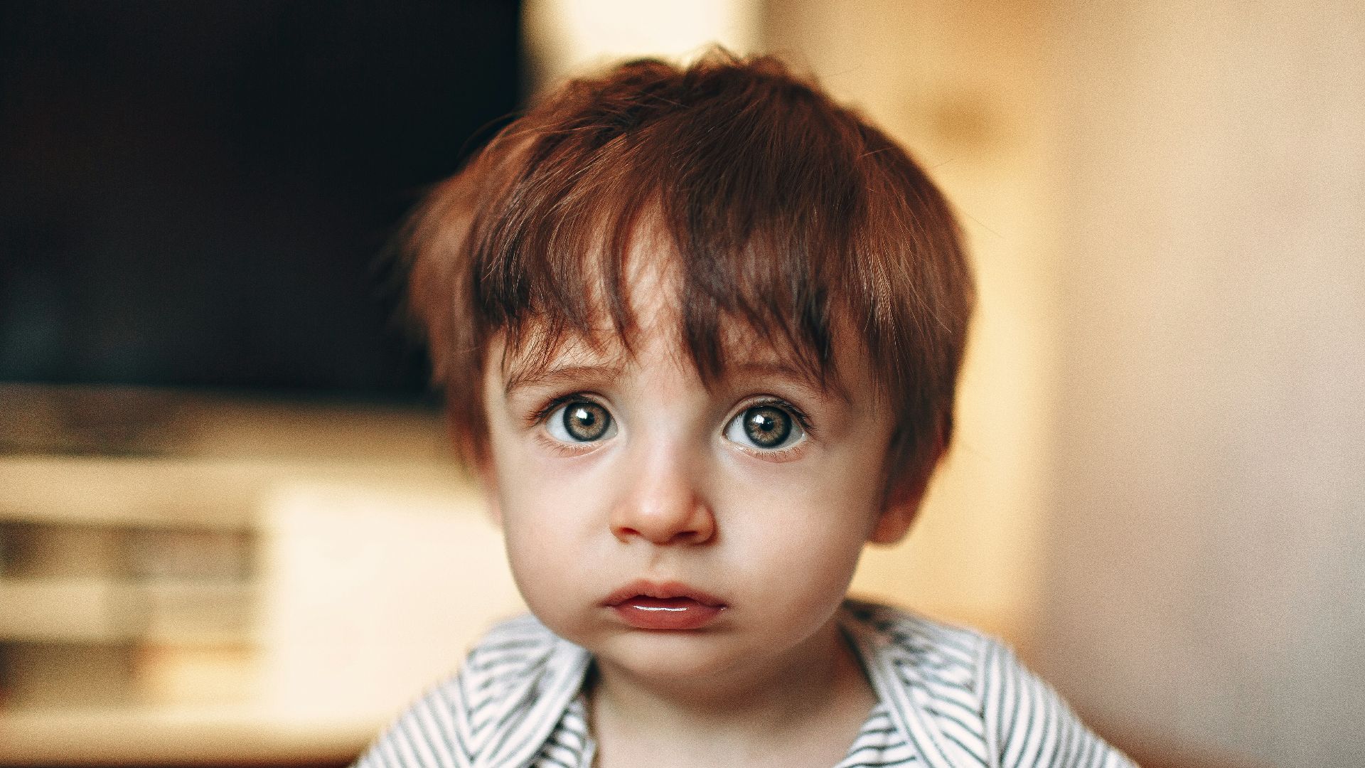 boy in white and black striped crew neck shirt