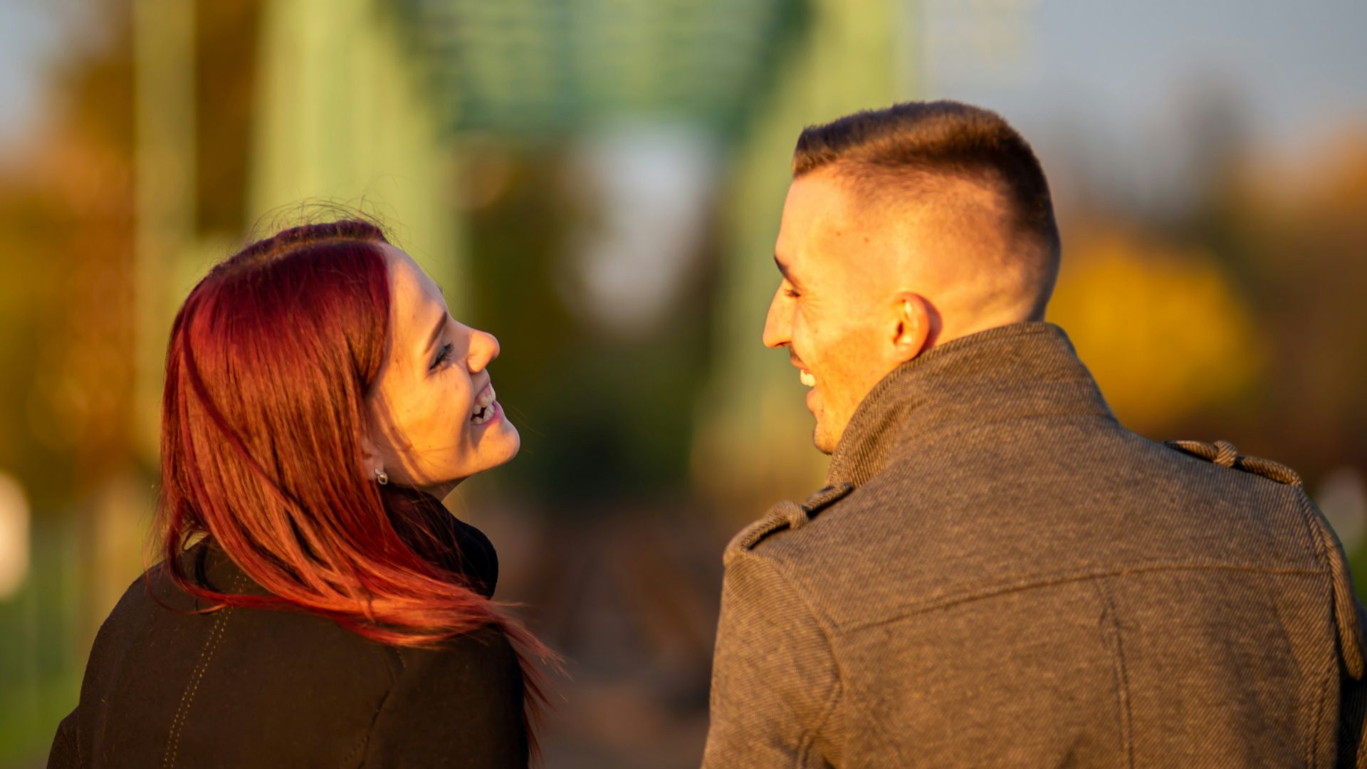 man and woman standing side by side during daytime