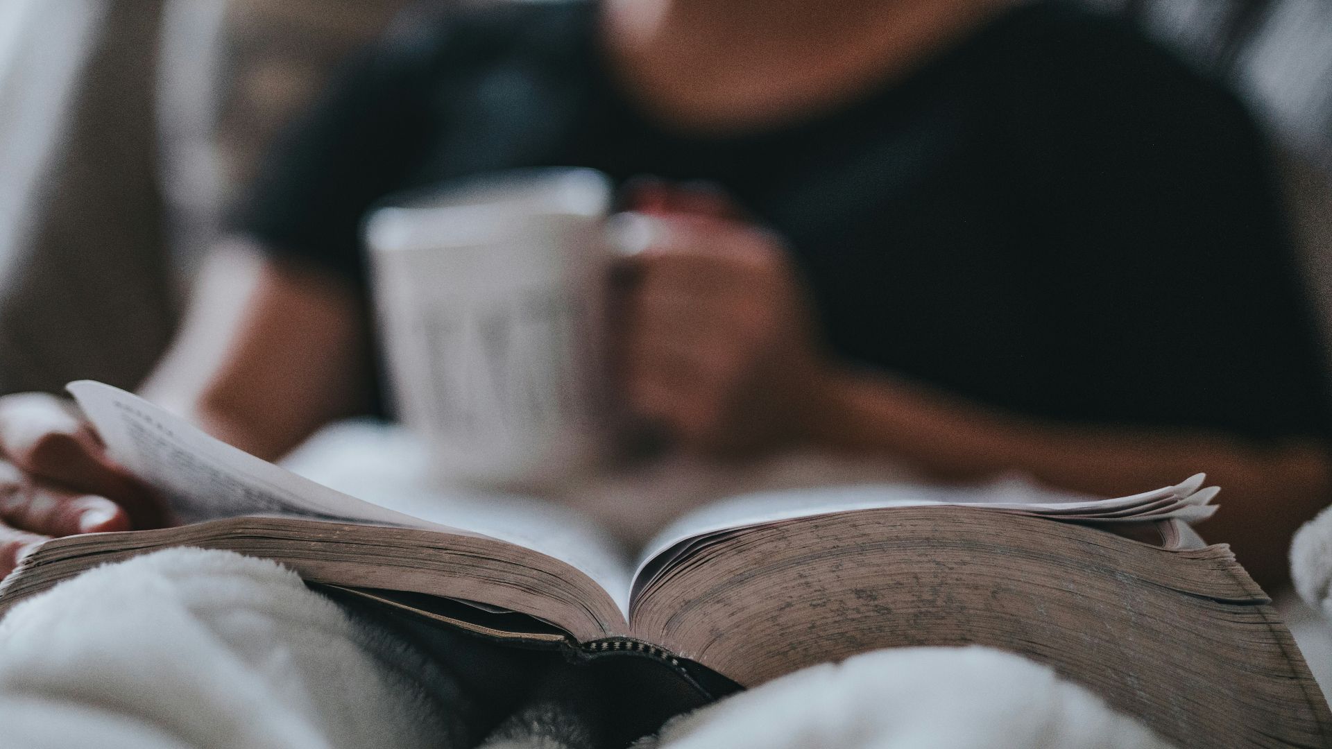 person holding coffee mug