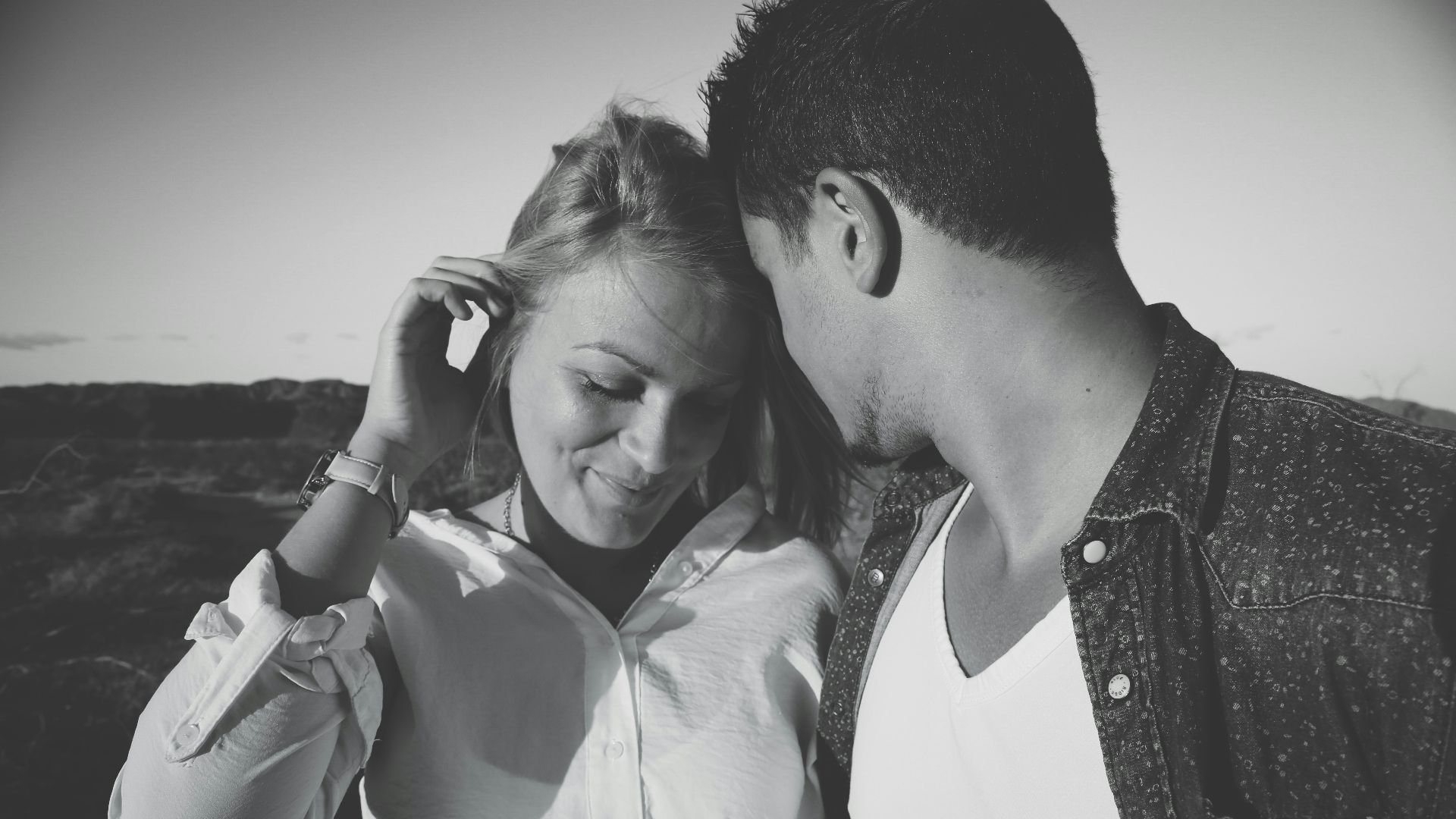 grayscale photography of man and woman