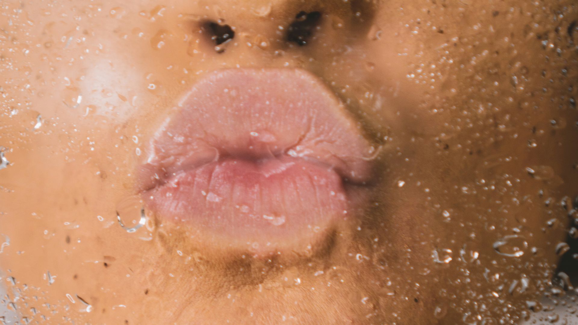 woman in water with water droplets