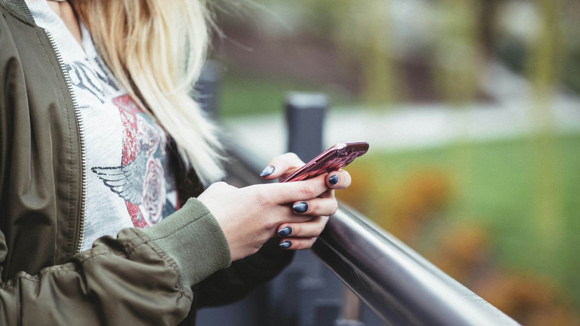woman holding red phone