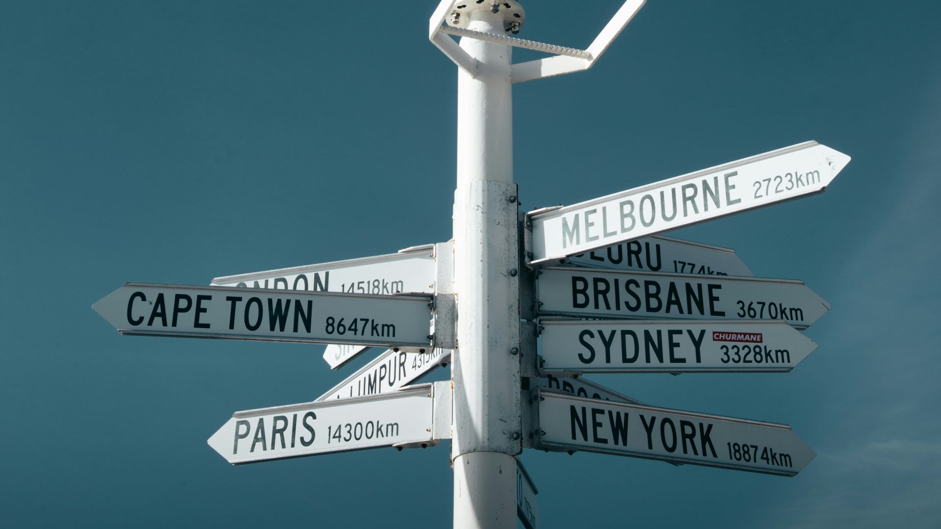 white and black street light under blue sky during daytime